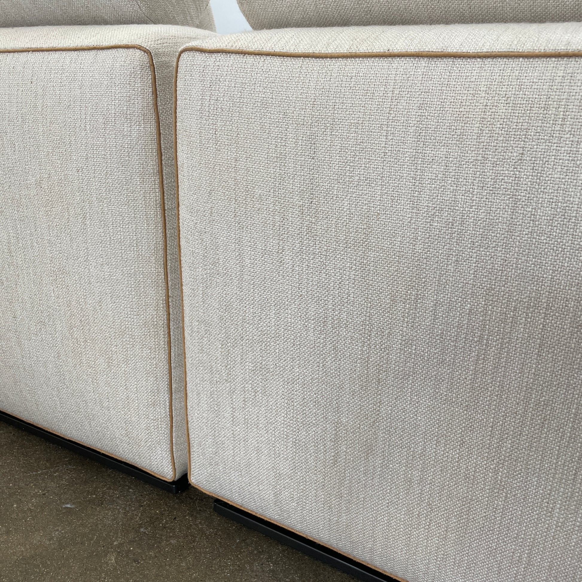 The Minotti Leonard 3 Piece Sectional by Minotti features an L-shaped beige design with three seat sections, multiple back and side cushions, and a right-side chaise lounge—ideal for an elegant living space—shown on a plain white background.