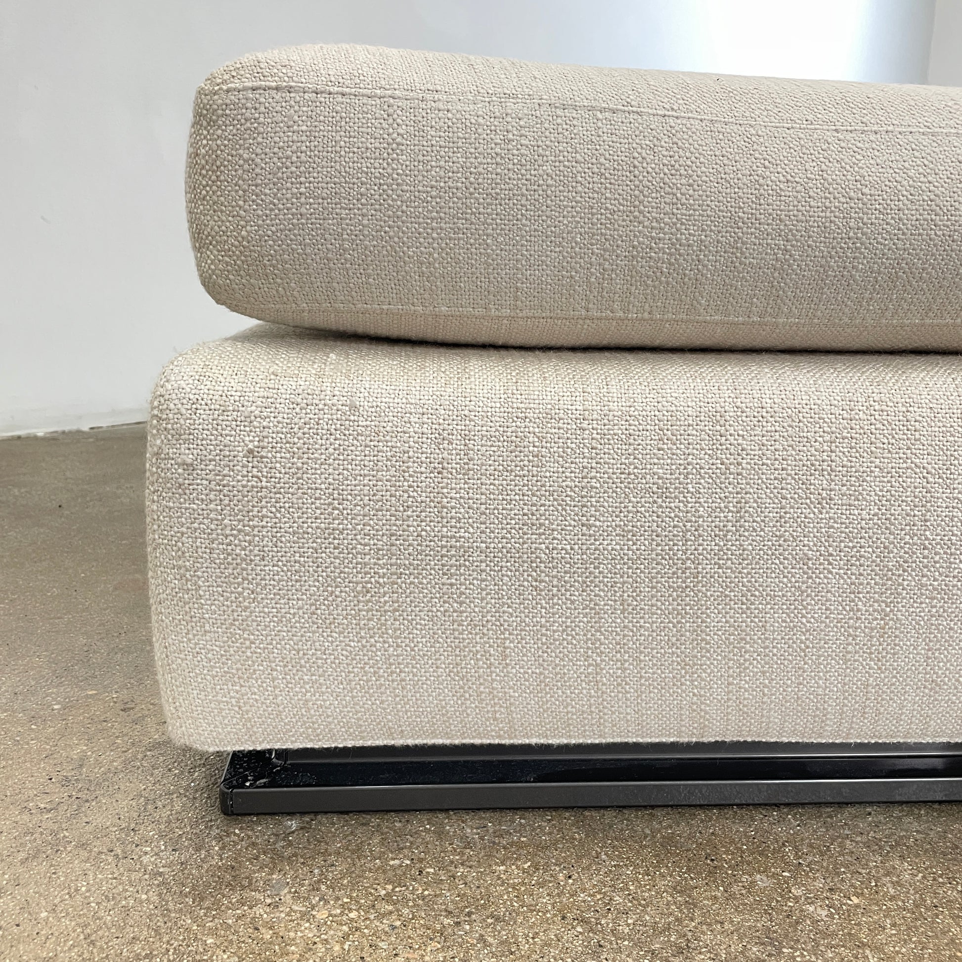 The Minotti Leonard 3 Piece Sectional by Minotti features an L-shaped beige design with three seat sections, multiple back and side cushions, and a right-side chaise lounge—ideal for an elegant living space—shown on a plain white background.