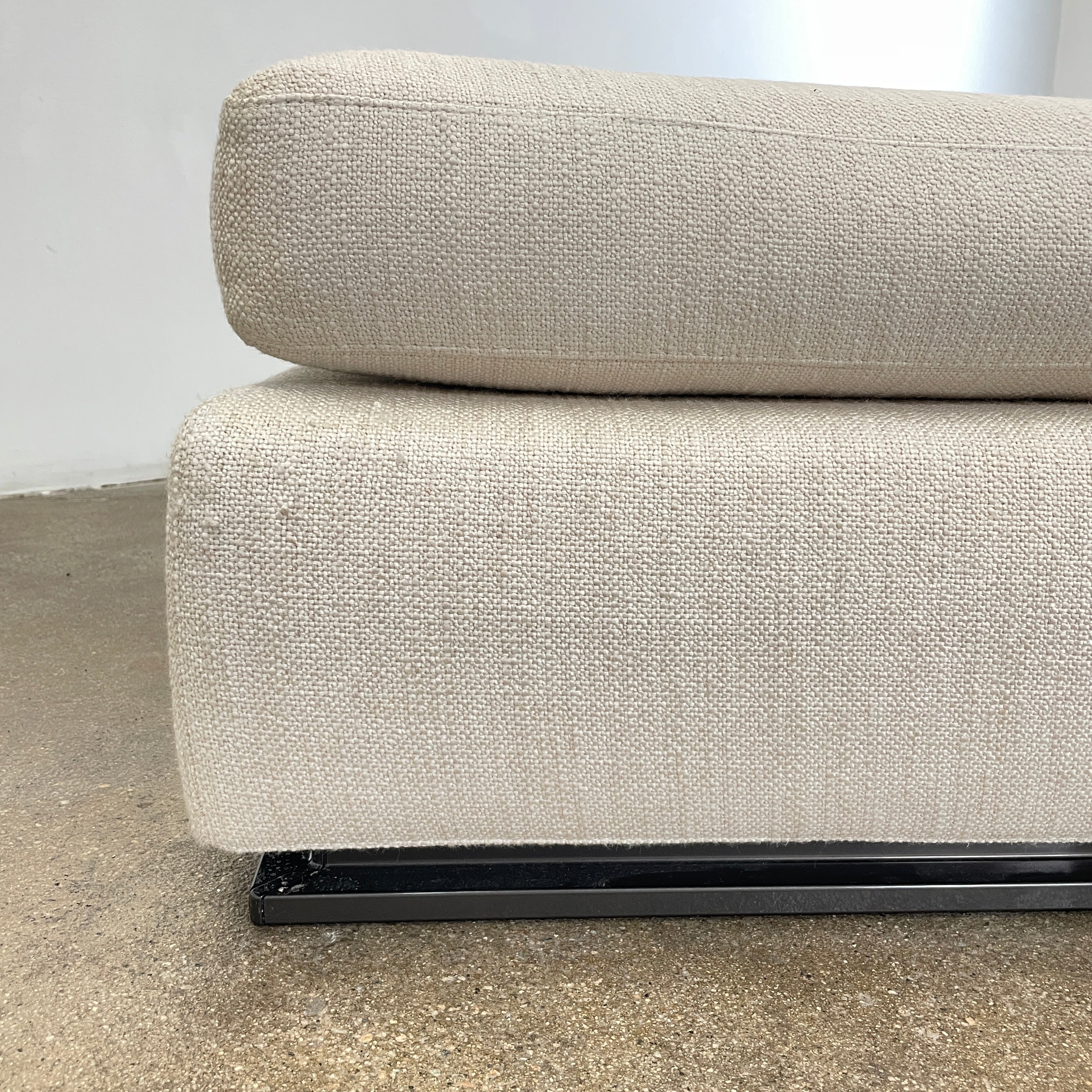 The Minotti Leonard 3 Piece Sectional by Minotti features an L-shaped beige design with three seat sections, multiple back and side cushions, and a right-side chaise lounge—ideal for an elegant living space—shown on a plain white background.