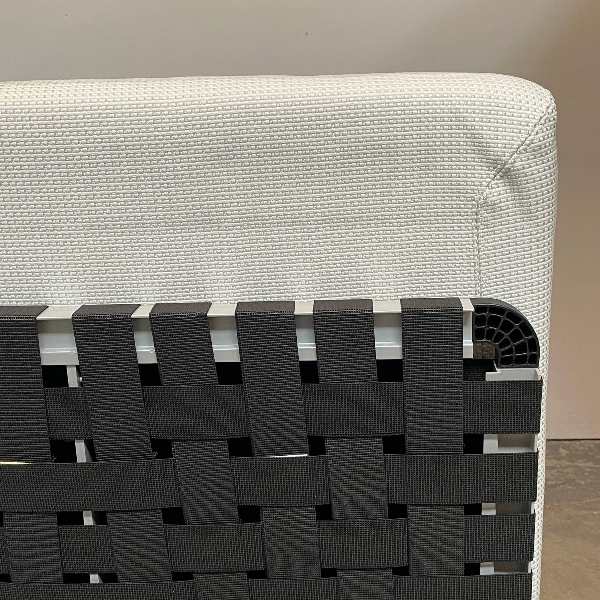 An adjustable white Paola Lenti Cove Double Sunbed by Paola Lenti features two separate reclining mattresses and matching pillows, perfect for outdoor lounging.