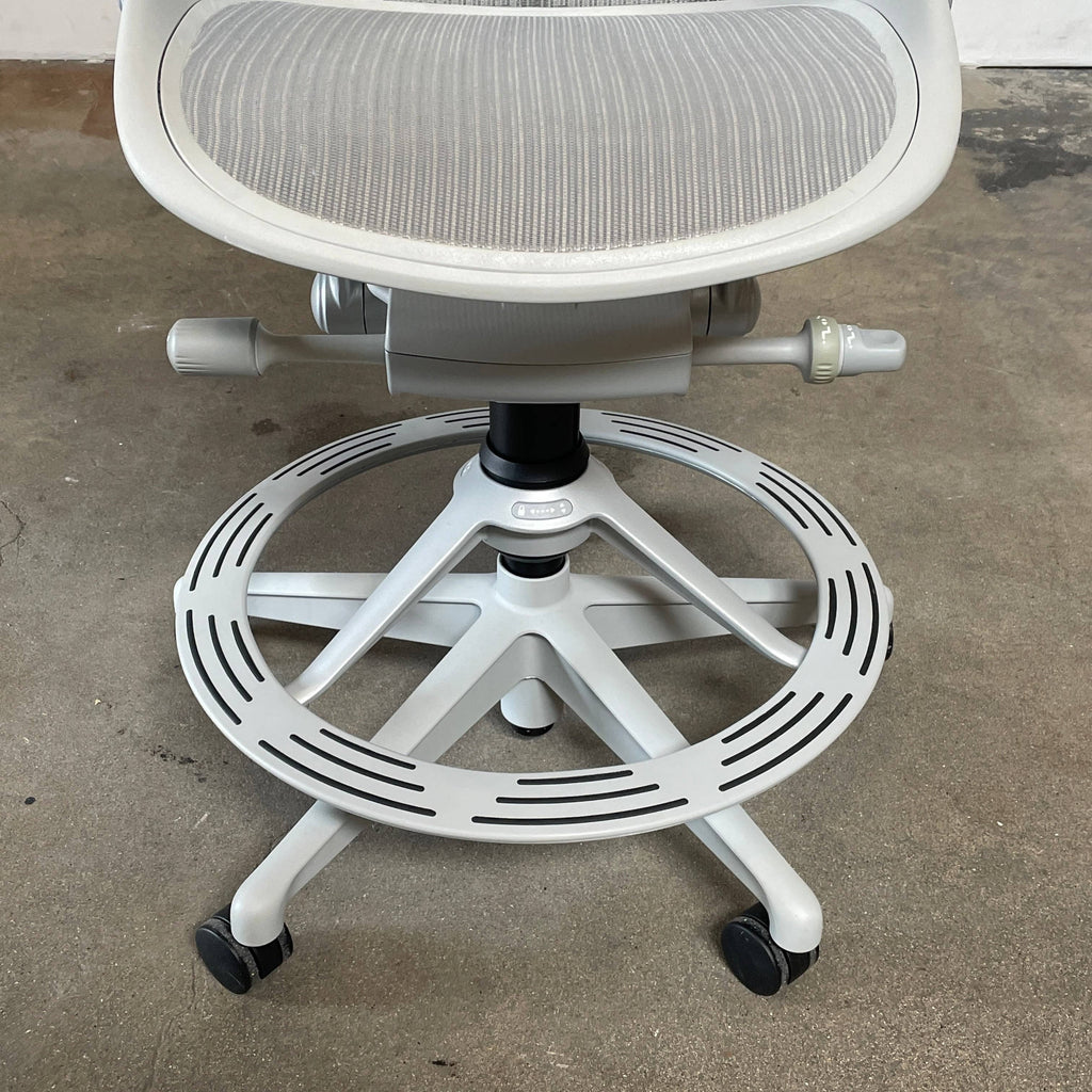An Herman Miller Aeron Office Counter Stool, manufactured by Herman Miller, with a mesh seat.