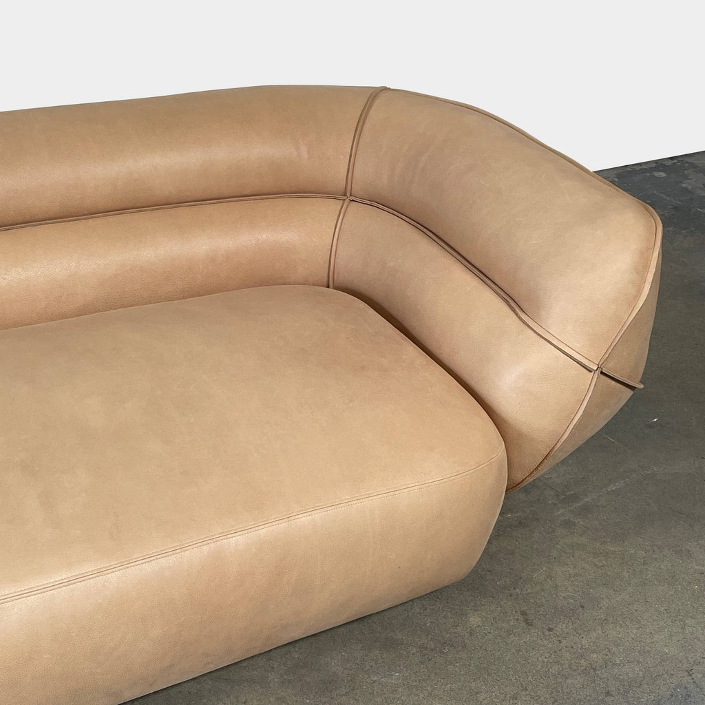 An ACE Daybed in tan leather from the Delcourt Collection, on a white background.