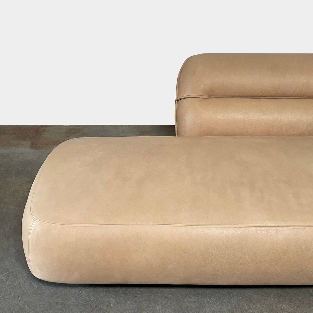 An ACE Daybed in tan leather from the Delcourt Collection, on a white background.