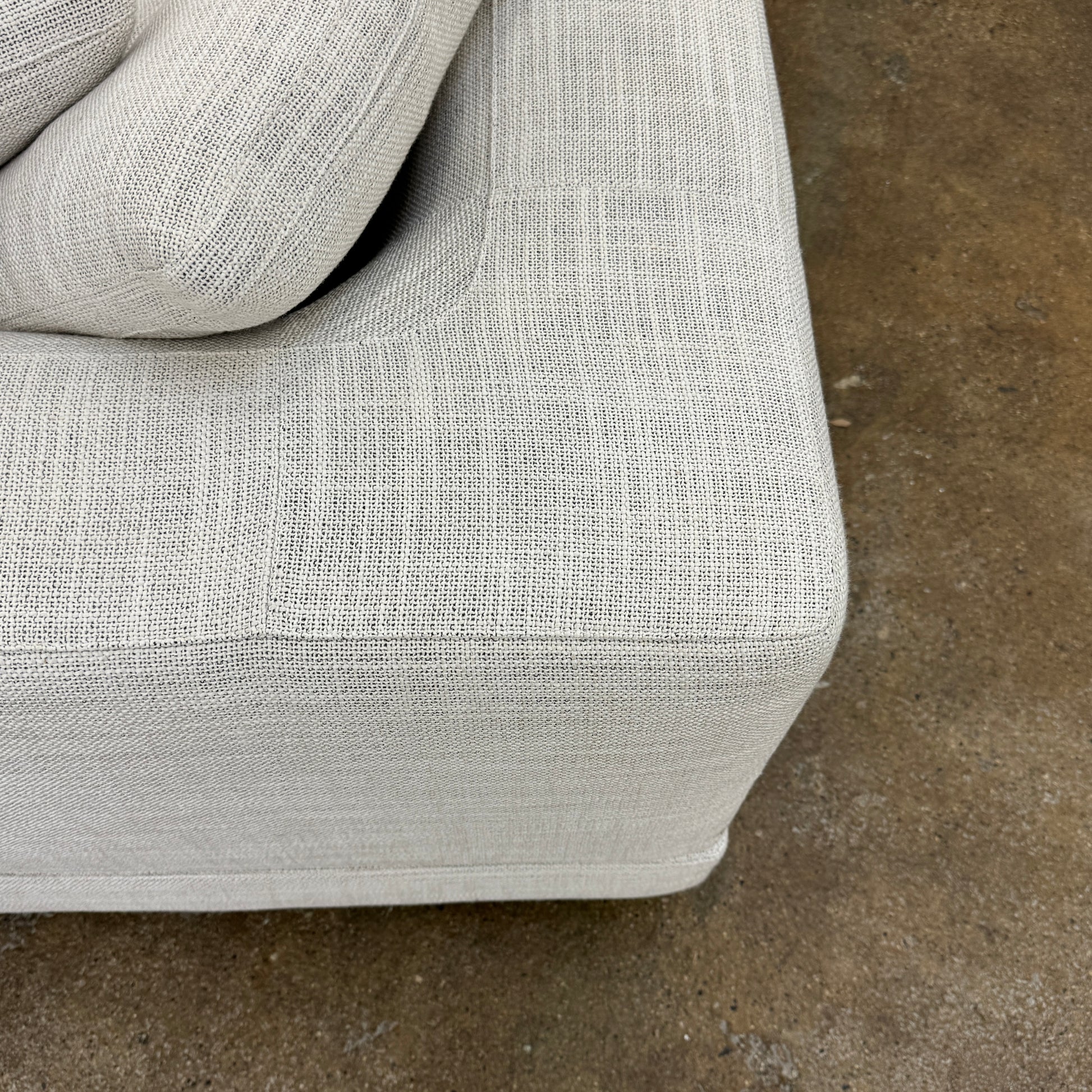 The Minotti Alexander 3 Piece Sectional by Minotti features an L-shaped design in light beige linen blend upholstery with multiple gray and beige throw pillows, set against a plain white background.