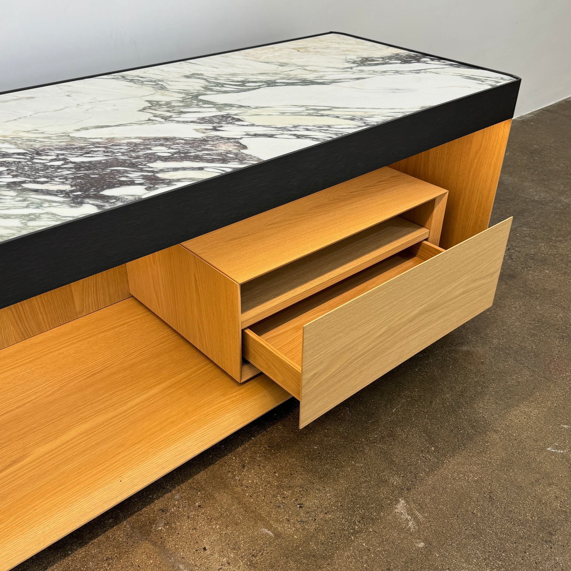 Enhance your home with the Molteni & C Living Box Console—a modern wooden piece with a marble top, two drawers, and open storage for books. Inspired by luxury furniture from Molteni & C, it works as both a coffee table and designer console.