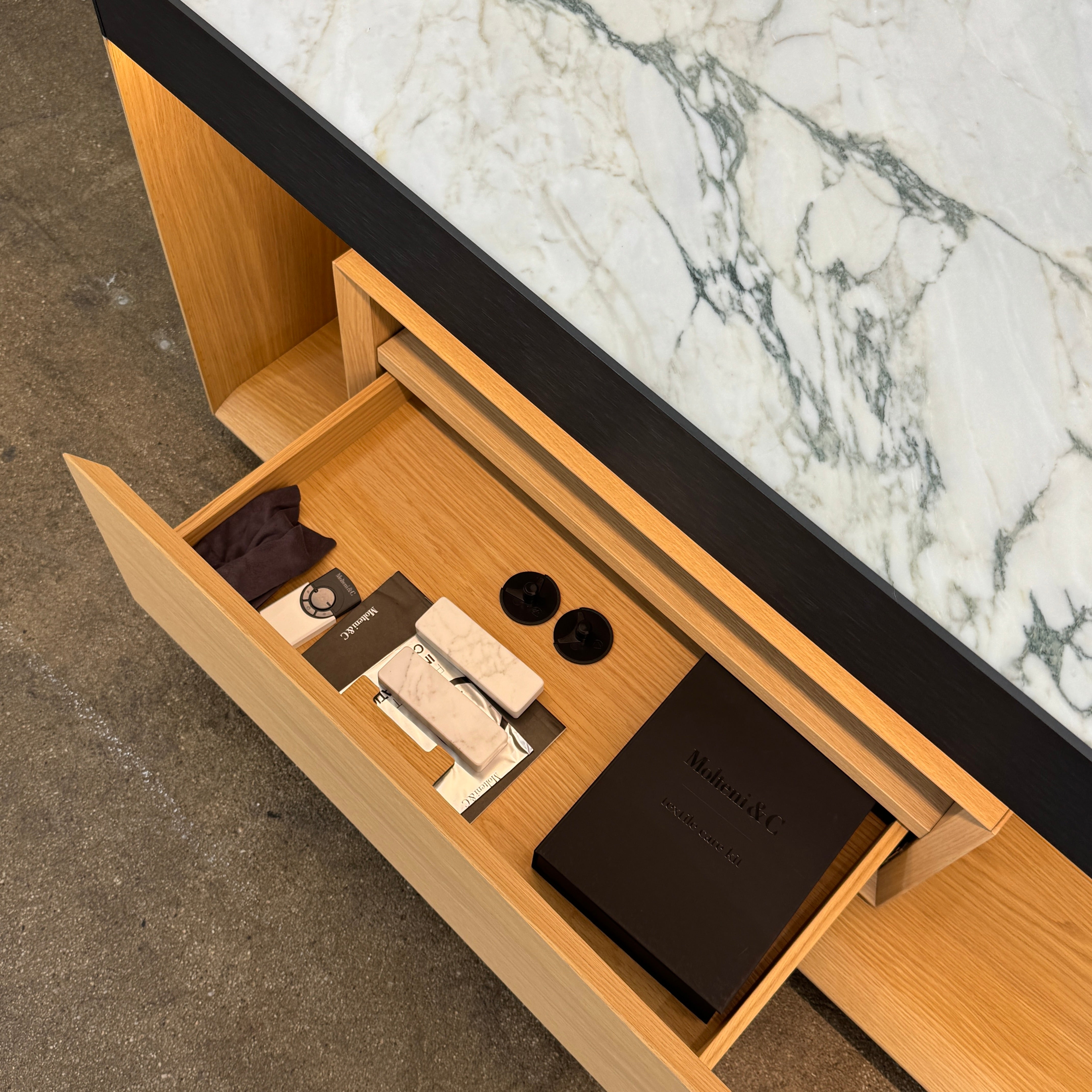 Enhance your home with the Molteni & C Living Box Console—a modern wooden piece with a marble top, two drawers, and open storage for books. Inspired by luxury furniture from Molteni & C, it works as both a coffee table and designer console.