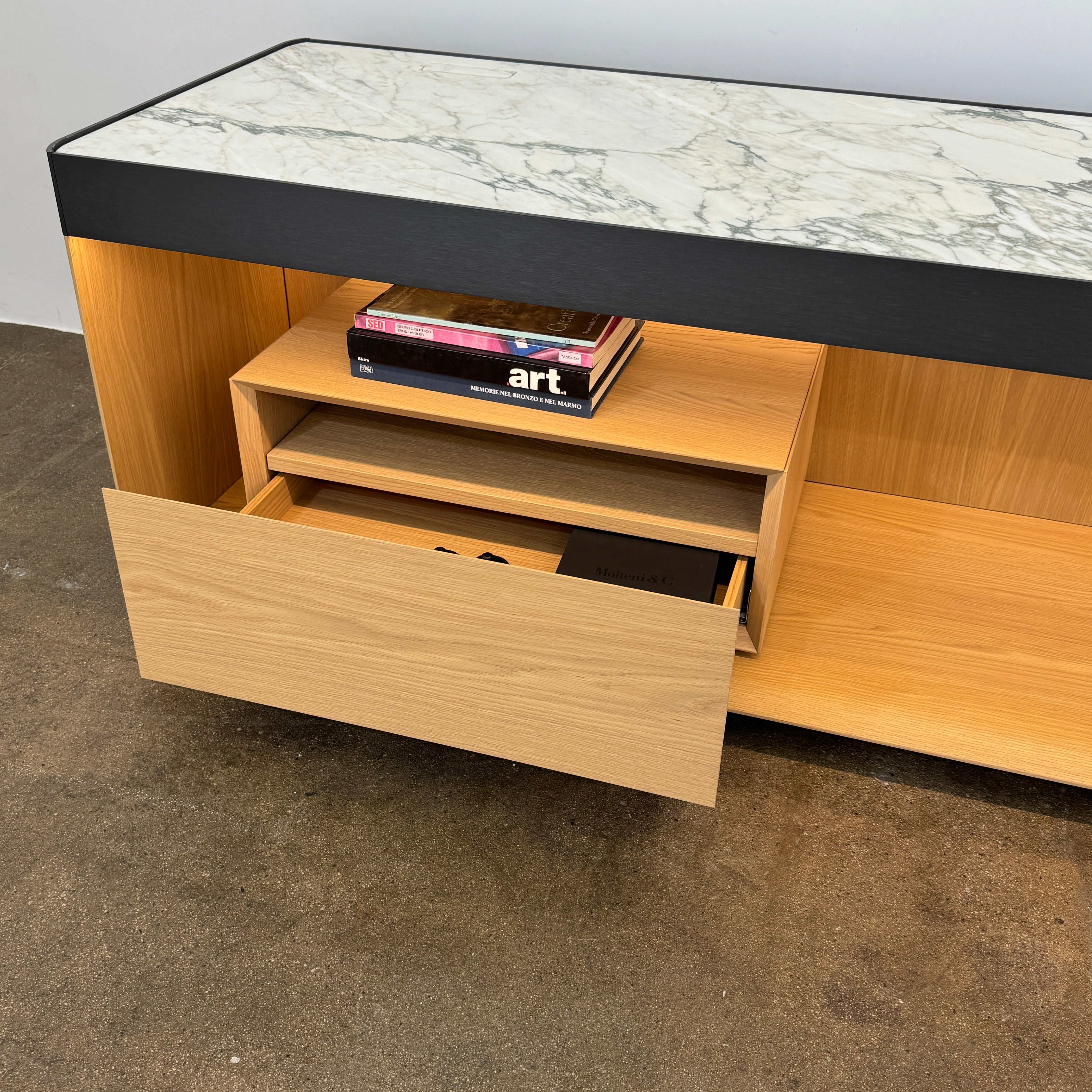 Enhance your home with the Molteni & C Living Box Console—a modern wooden piece with a marble top, two drawers, and open storage for books. Inspired by luxury furniture from Molteni & C, it works as both a coffee table and designer console.
