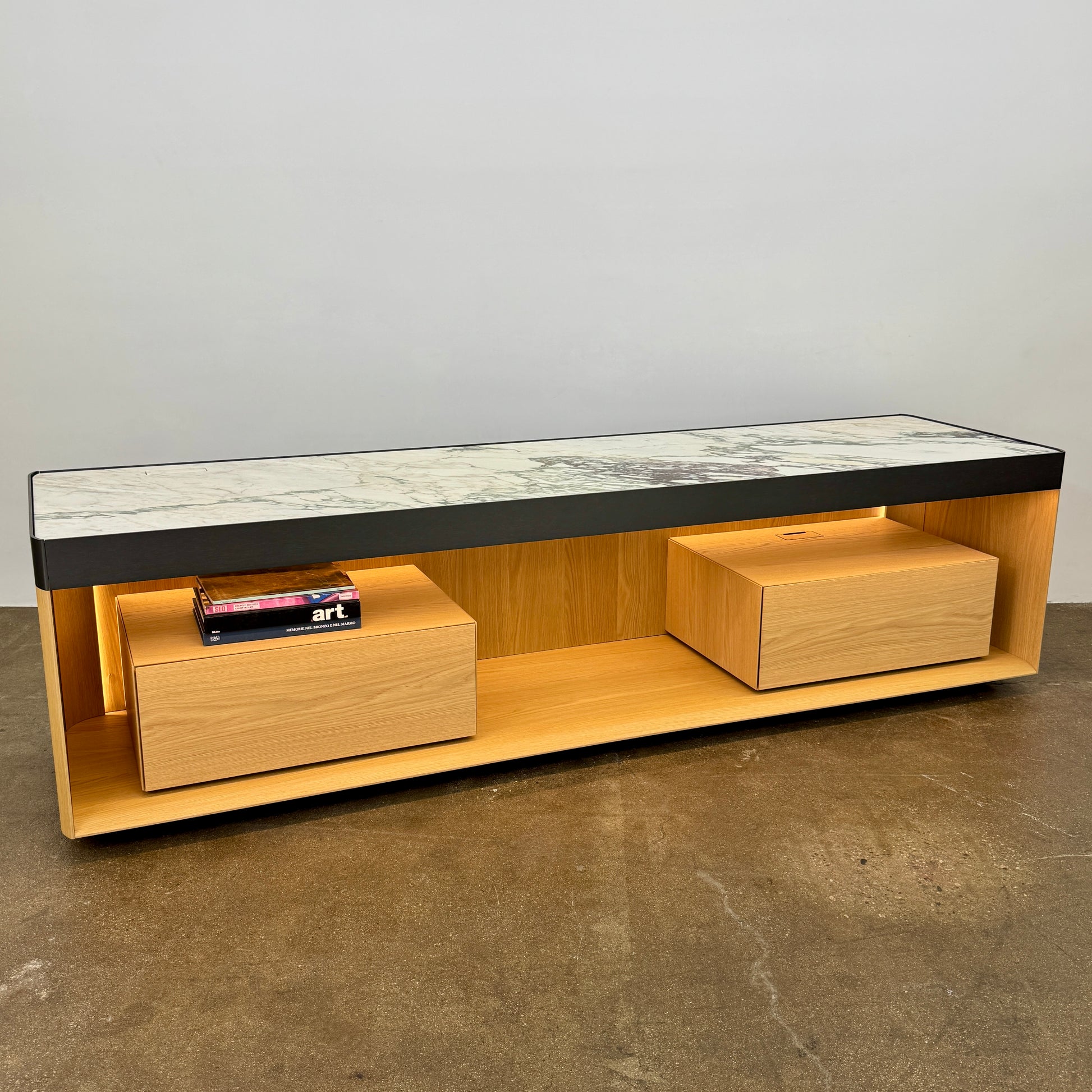 Enhance your home with the Molteni & C Living Box Console—a modern wooden piece with a marble top, two drawers, and open storage for books. Inspired by luxury furniture from Molteni & C, it works as both a coffee table and designer console.