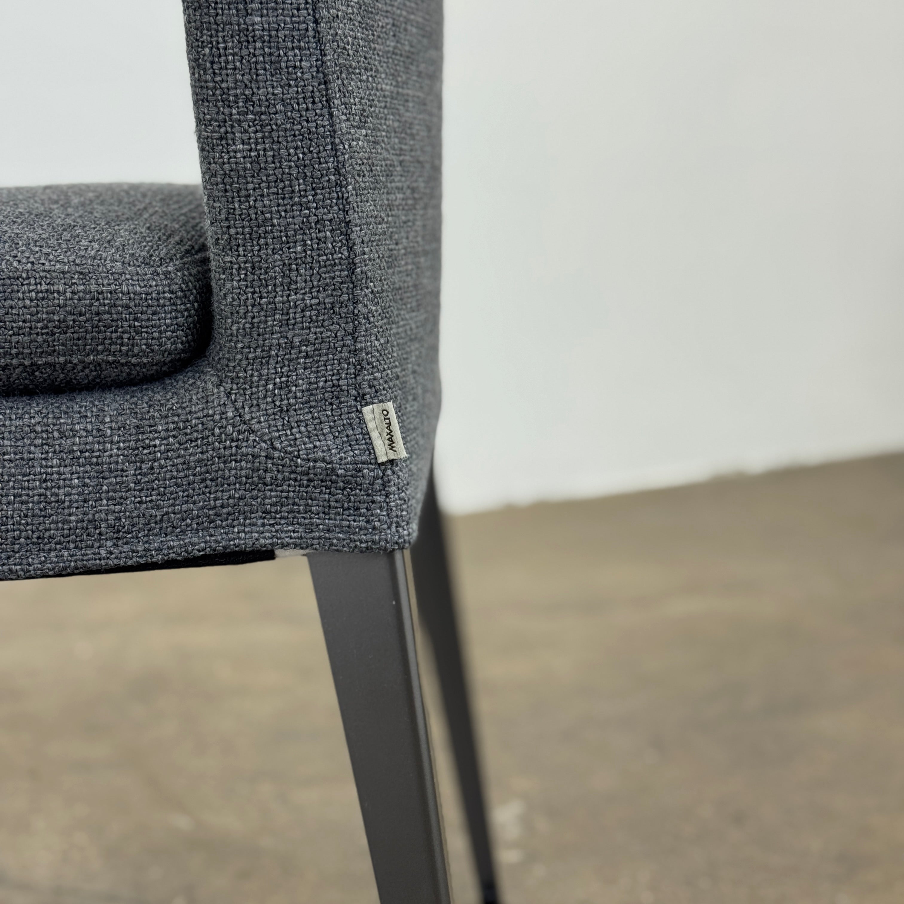 Set of 6 Maxalto Dining Eunice Chairs by Maxalto, featuring gray upholstery and sleek metal legs, arranged in two rows against a plain white background.