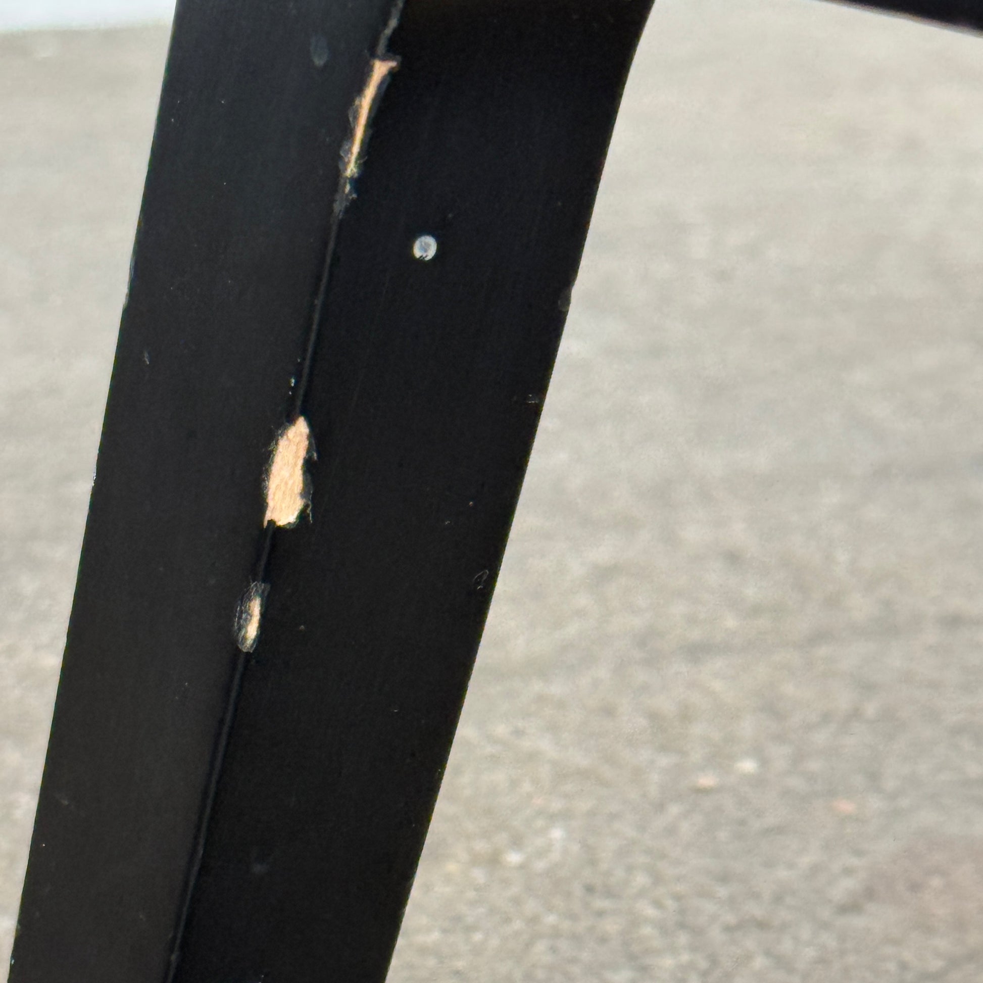 A pair of Maxalto Fulgens Armchair set (2) by Maxalto, in dark brown leather with black wooden frames, are placed side by side against a plain white background.