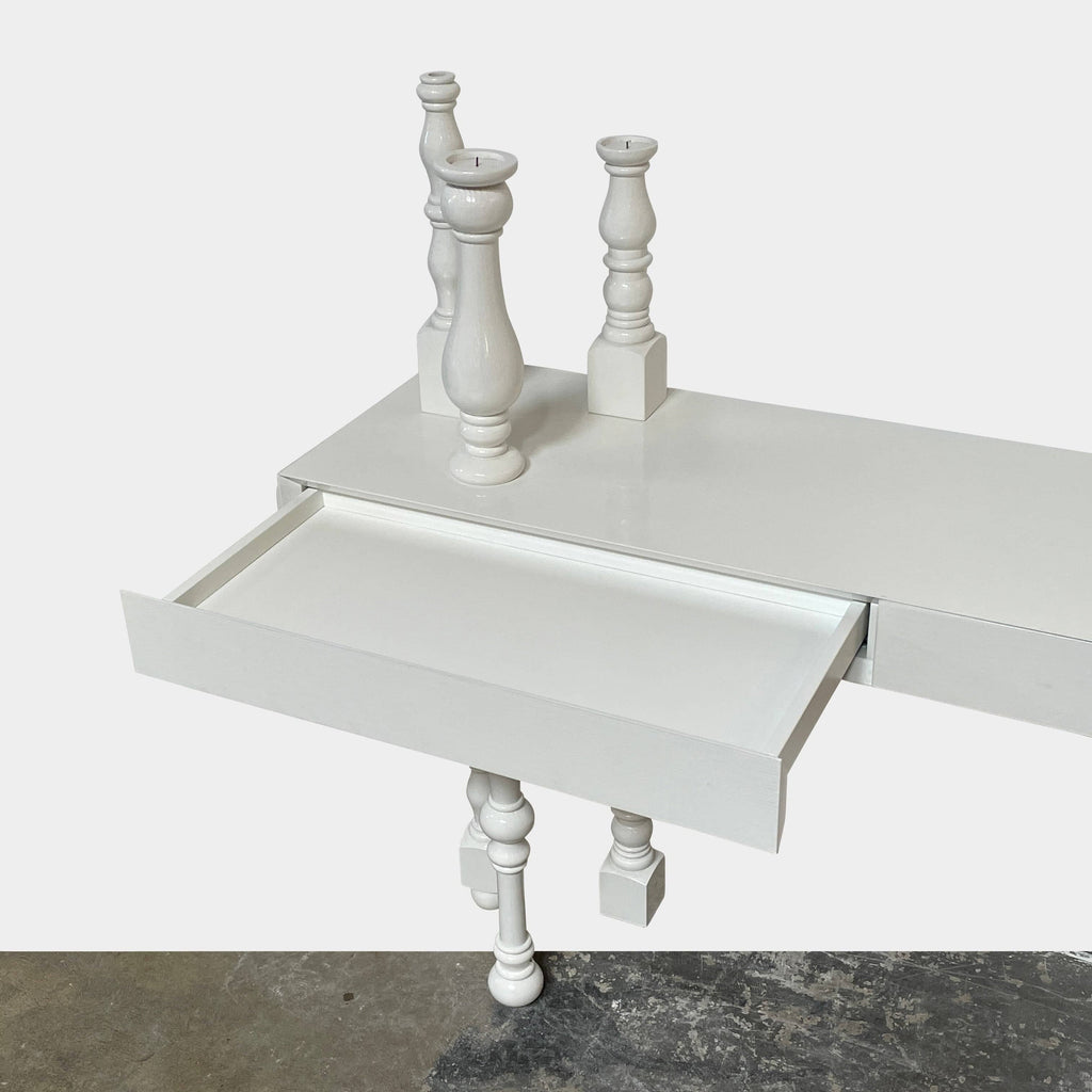 Annabeth Philips's Mogg Bugie Console table features two candle holders.