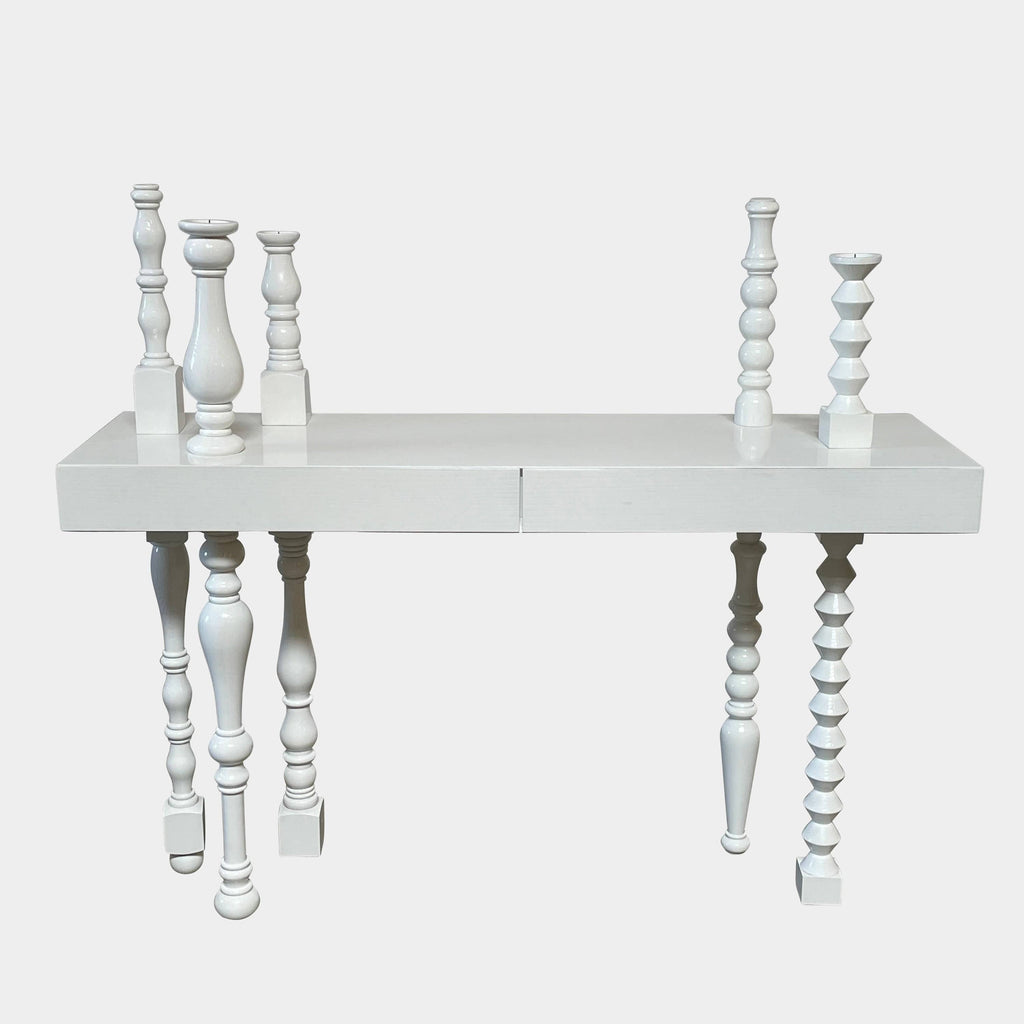 Annabeth Philips's Mogg Bugie Console table features two candle holders.