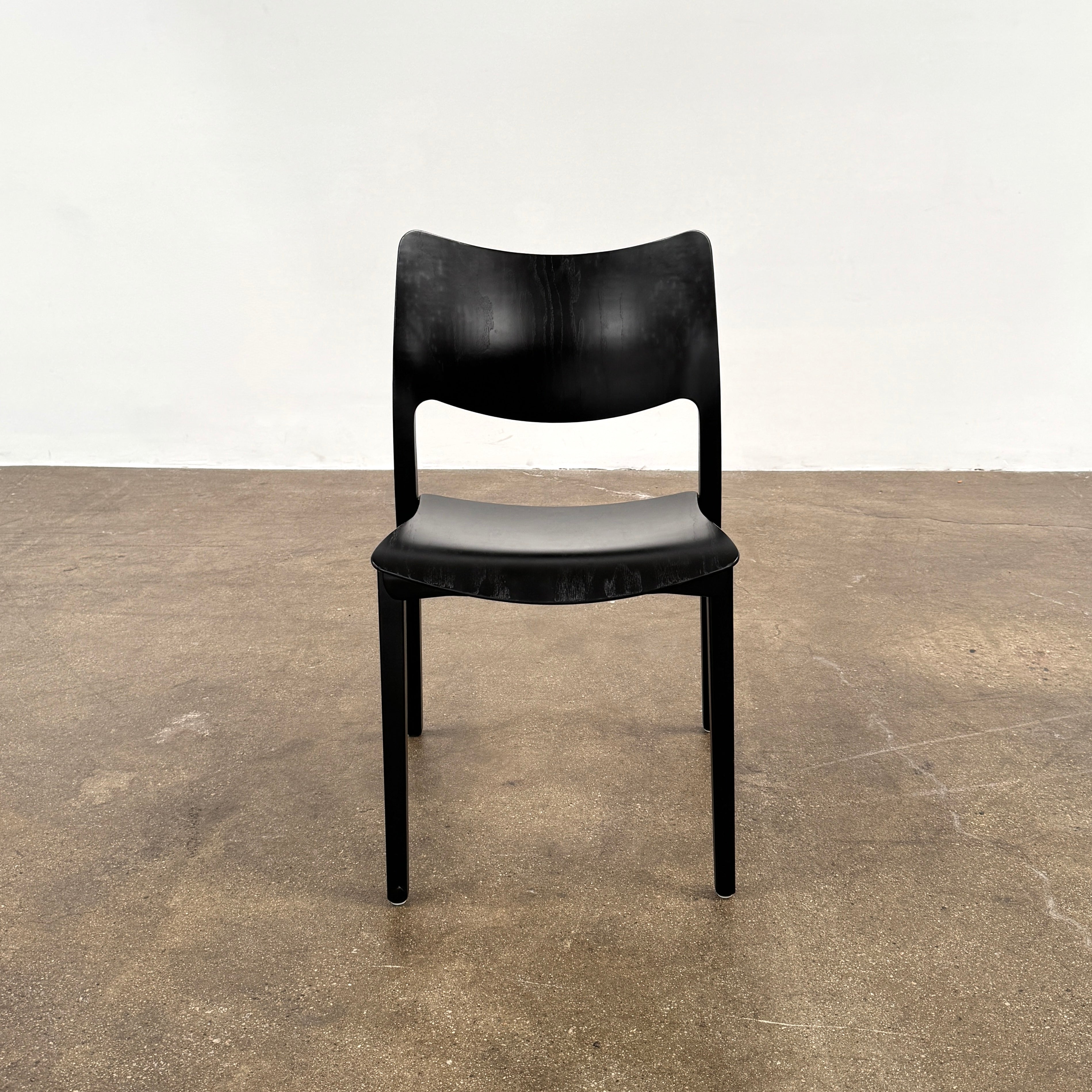 A set of four Stua LaClassica Bastua Dining Chairs by Stua, featuring solid wood with visible grain and gently curved backs and seats, are shown in two rows on a plain white background.