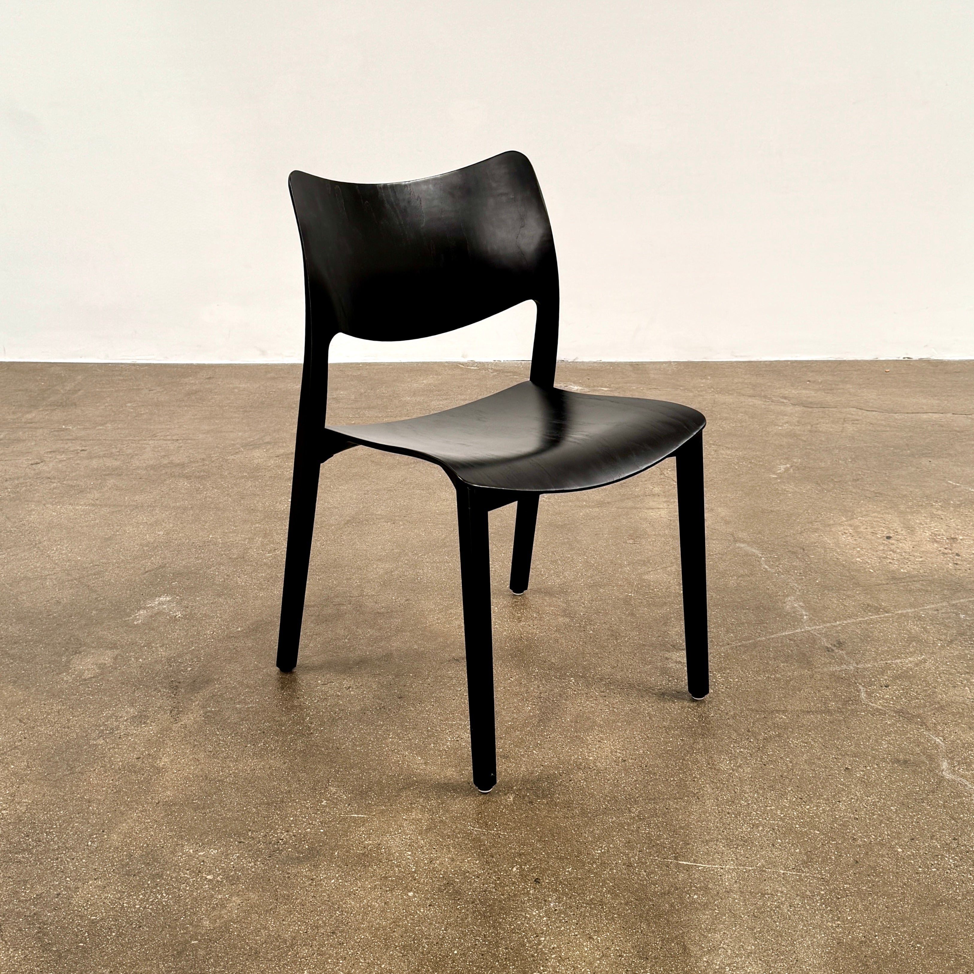 A set of four Stua LaClassica Bastua Dining Chairs by Stua, featuring solid wood with visible grain and gently curved backs and seats, are shown in two rows on a plain white background.