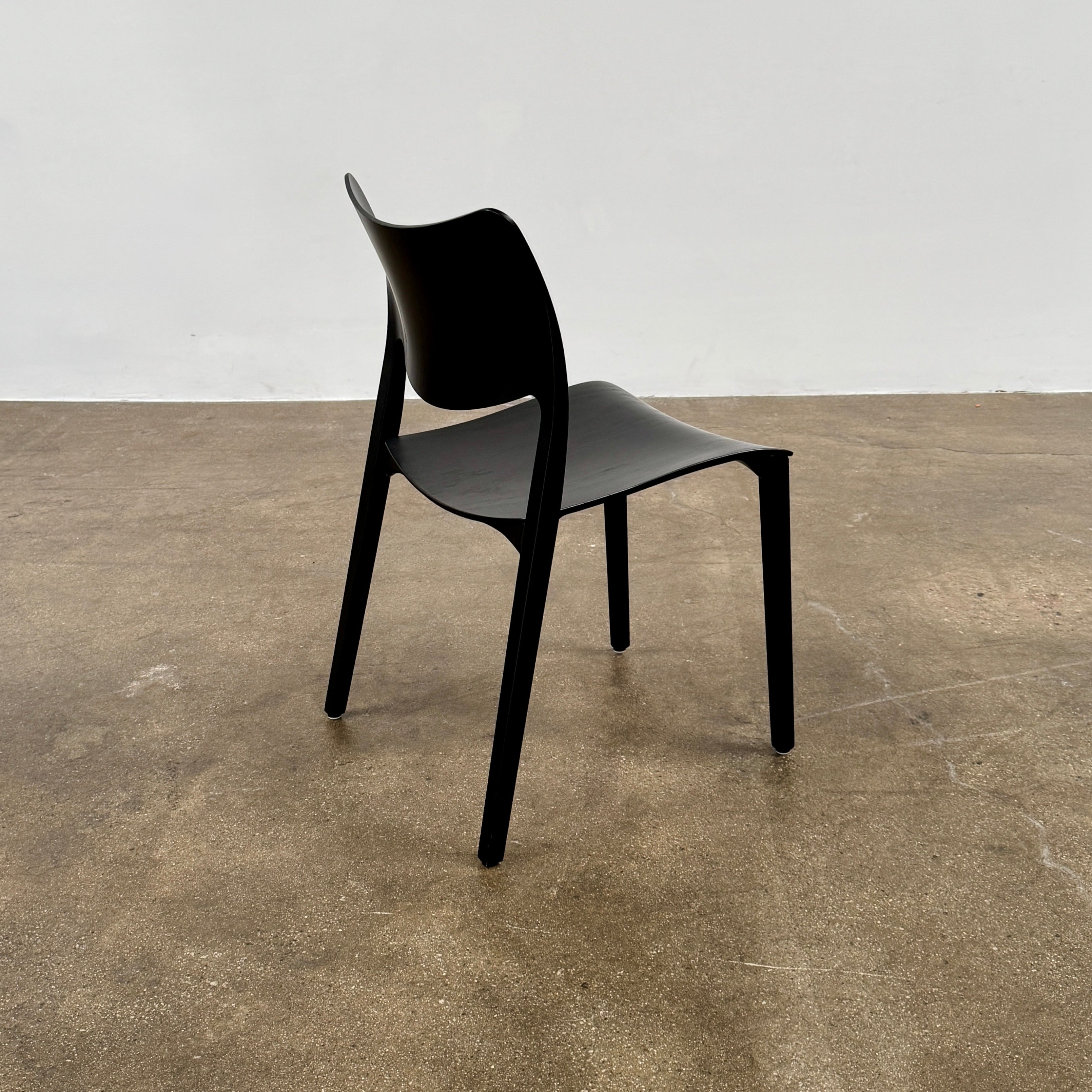 A set of four Stua LaClassica Bastua Dining Chairs by Stua, featuring solid wood with visible grain and gently curved backs and seats, are shown in two rows on a plain white background.