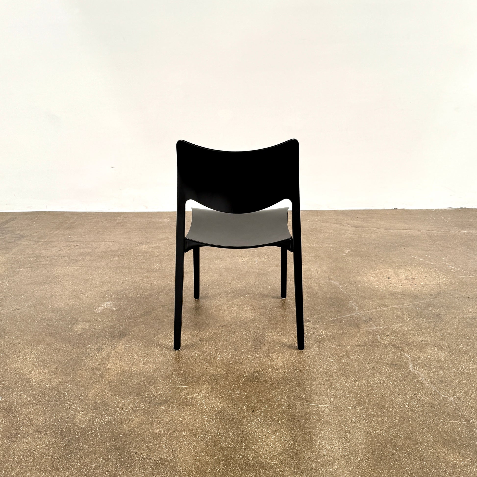 A set of four Stua LaClassica Bastua Dining Chairs by Stua, featuring solid wood with visible grain and gently curved backs and seats, are shown in two rows on a plain white background.