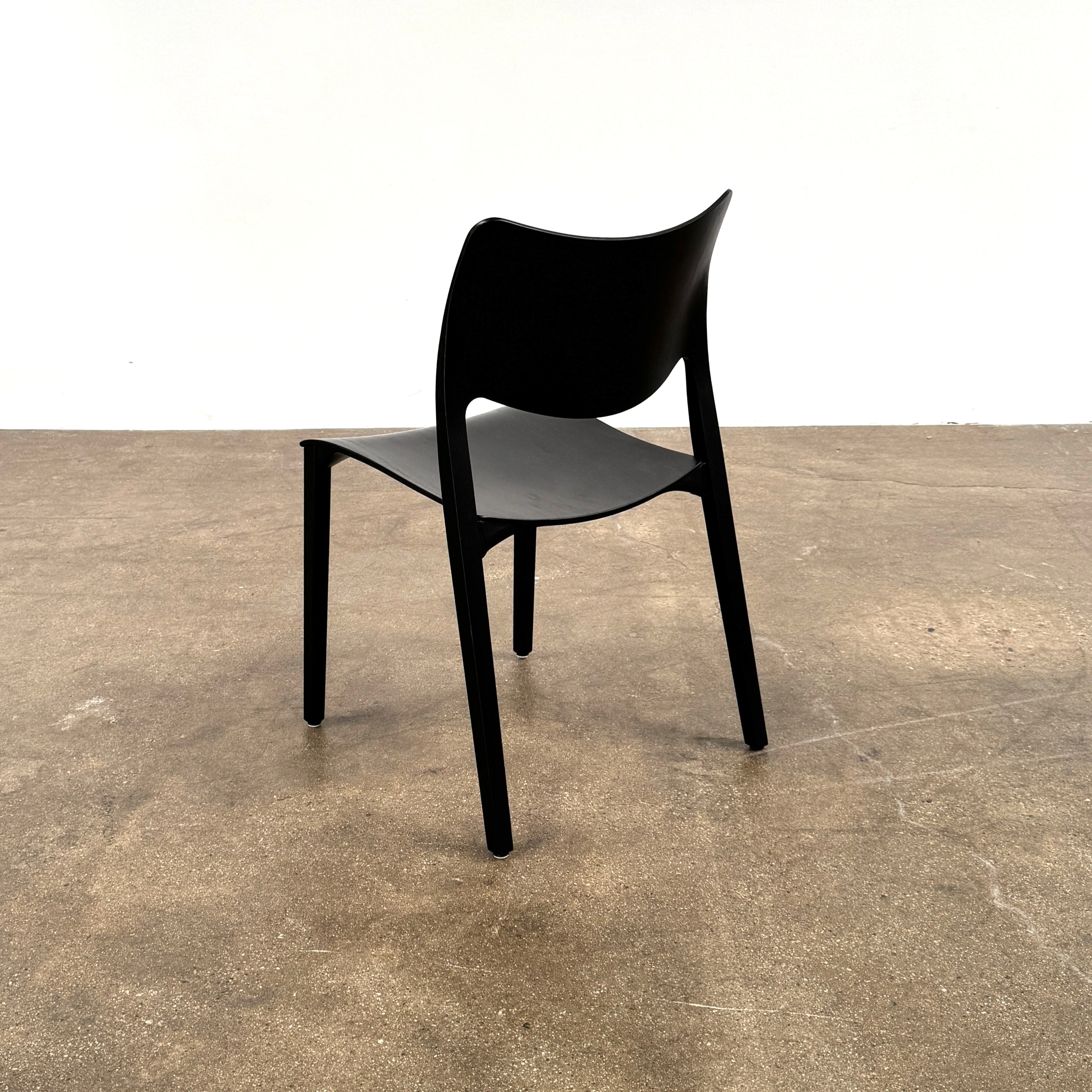 A set of four Stua LaClassica Bastua Dining Chairs by Stua, featuring solid wood with visible grain and gently curved backs and seats, are shown in two rows on a plain white background.