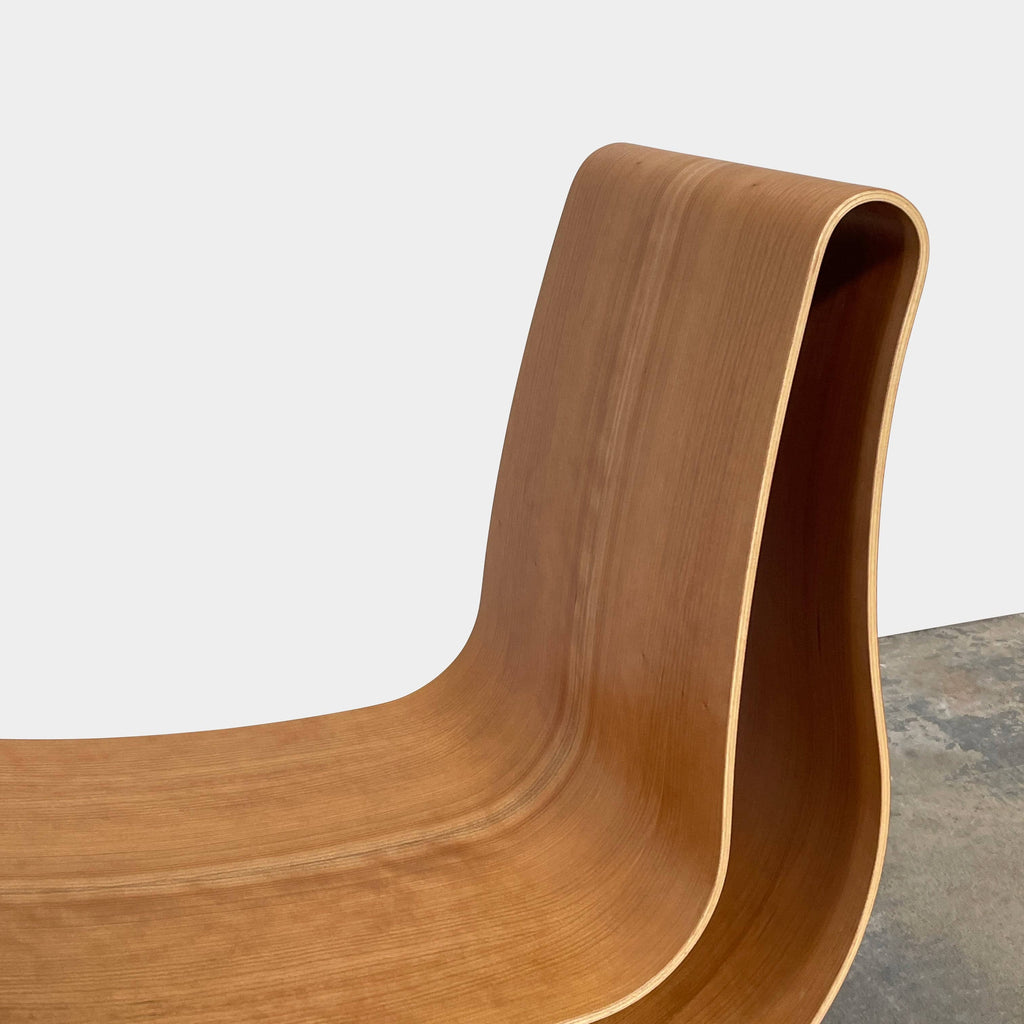 Two unique Emmemobili Boa accent chairs made of curved beech plywood on a white background.