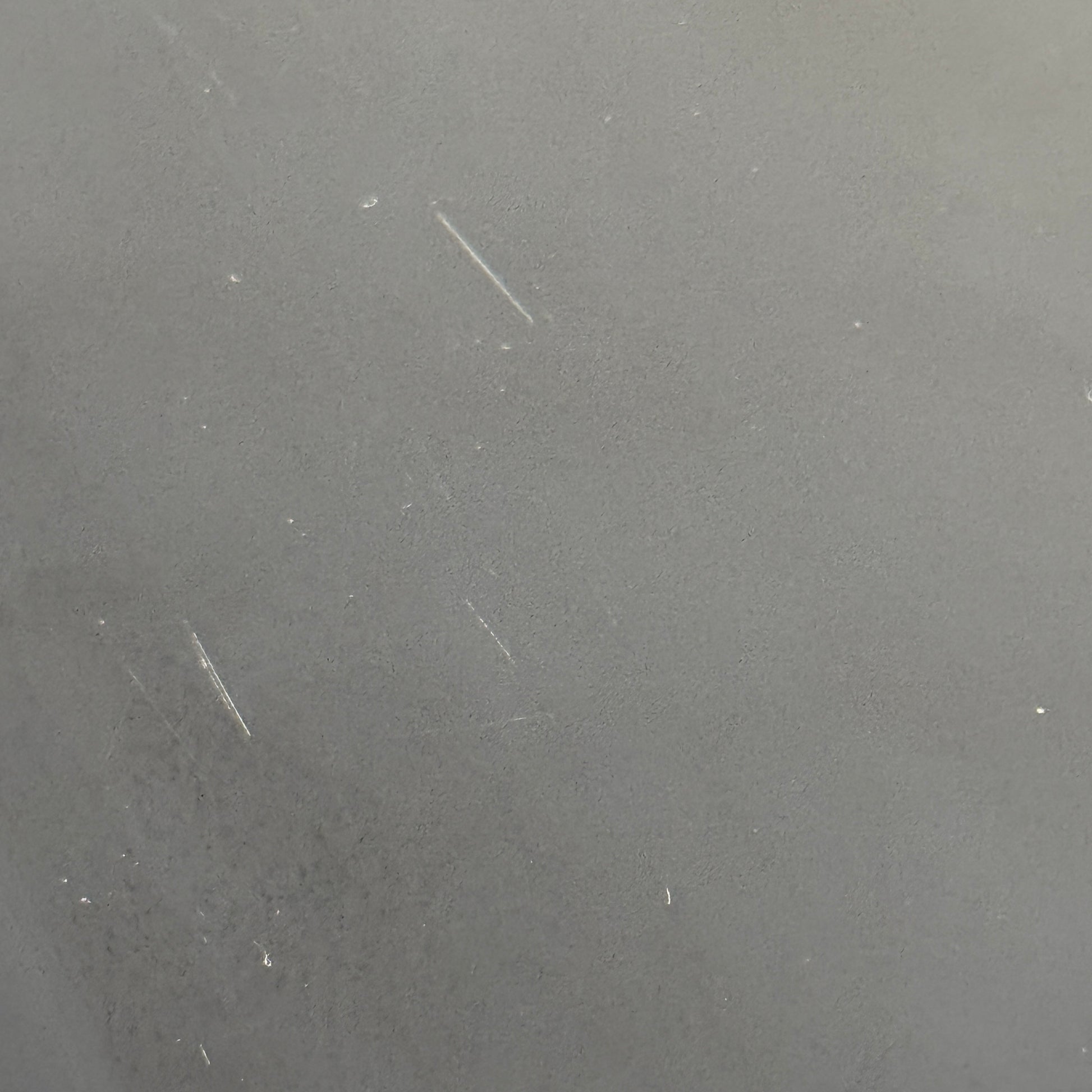 The Kartell Trays Trolly by Kartell features three black metal tiers, glass shelves, and four wheels, displayed on a plain white background.