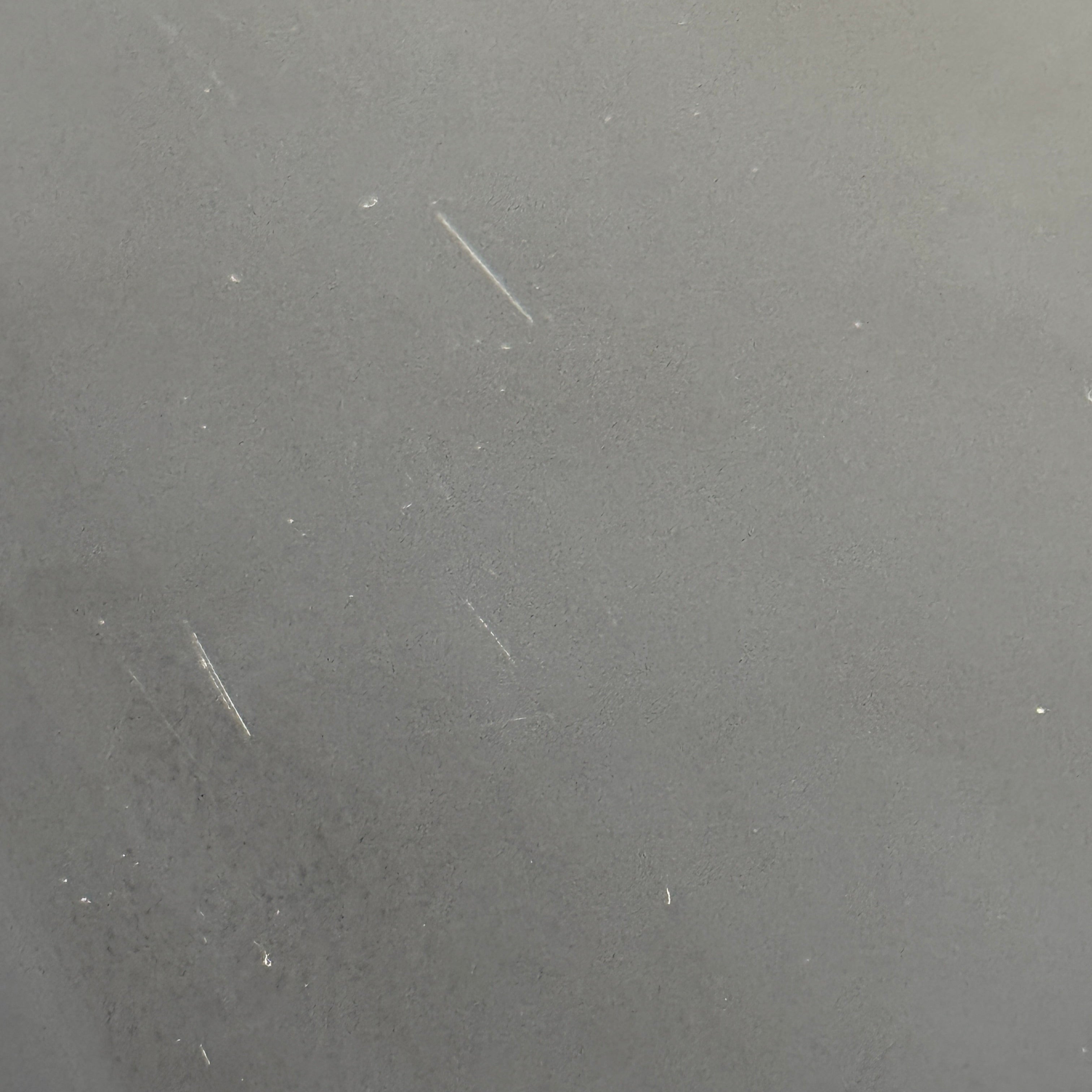 The Kartell Trays Trolly by Kartell features three black metal tiers, glass shelves, and four wheels, displayed on a plain white background.