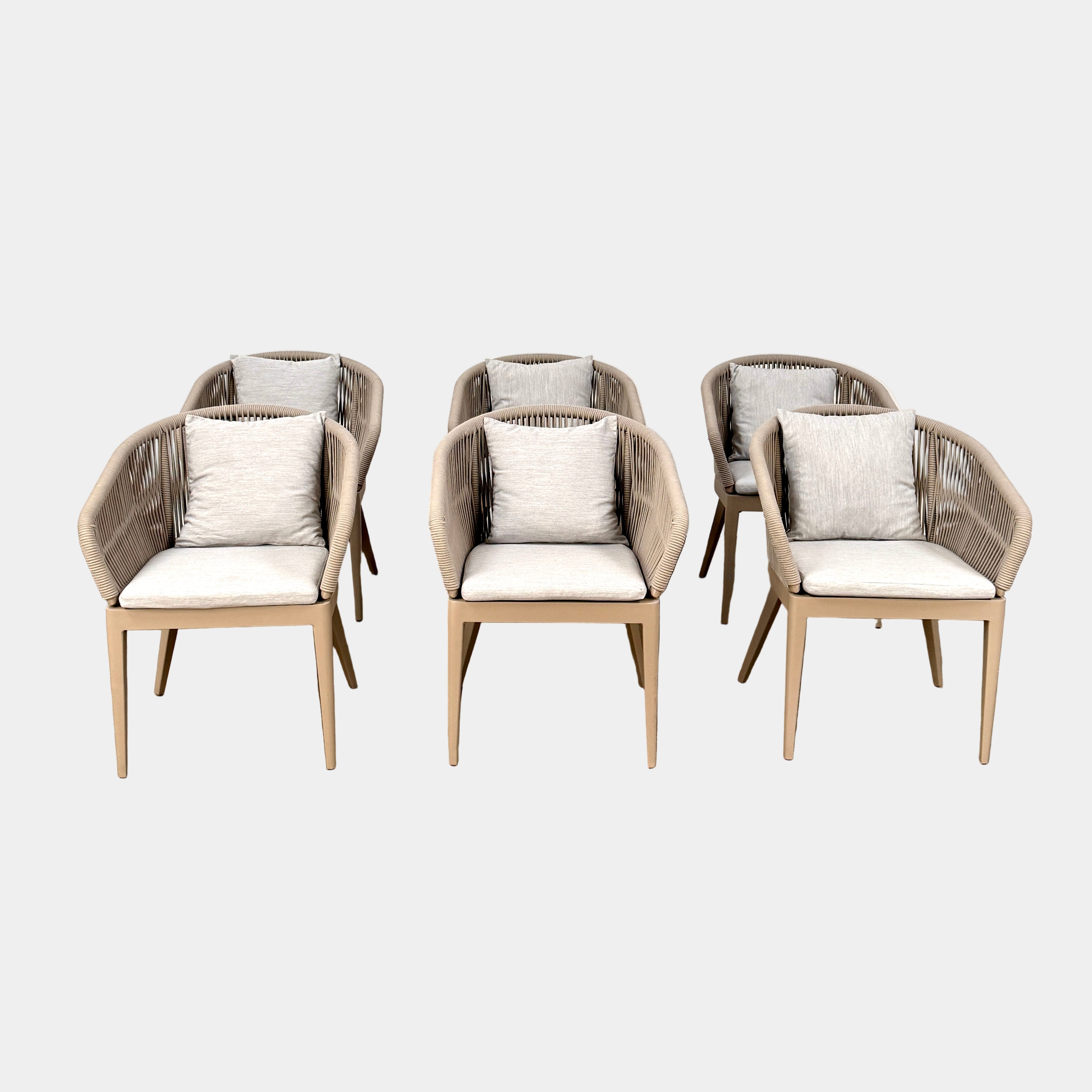 Six Harbour Hamilton Outdoor Dining Chairs by Harbour, featuring a beige woven design with light cushions, are arranged in two rows of three on a plain light background.