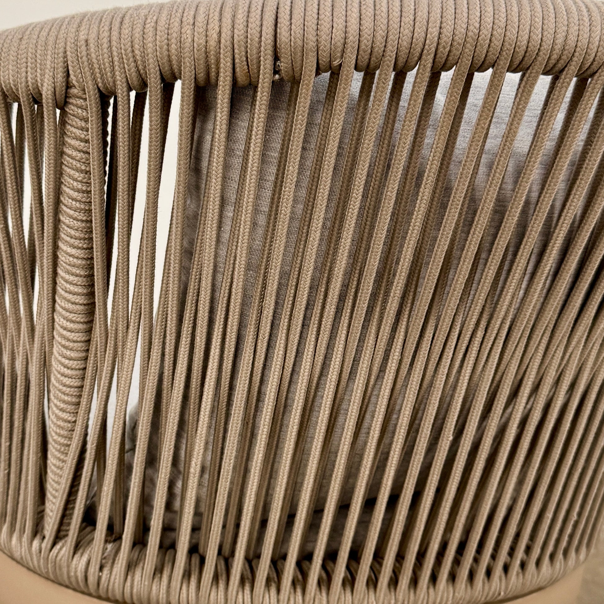 Six Harbour Hamilton Outdoor Dining Chairs by Harbour, featuring a beige woven design with light cushions, are arranged in two rows of three on a plain light background.