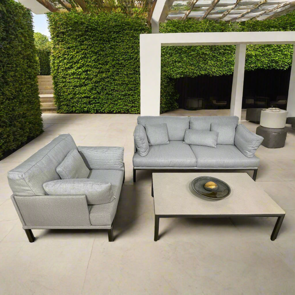 Two light gray sofas from the Point 1920 Long Island Outdoor Seating Set, featuring matching cushions and GOOD SIDE slat suspension, are arranged around a rectangular coffee table on a plain white background.