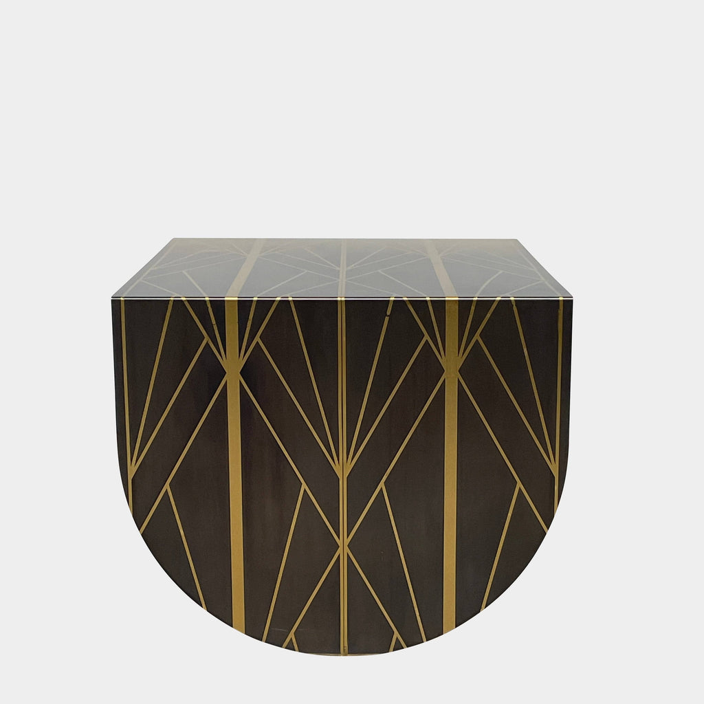 A TrackDesign Aestus Brass Side Table with a geometric design.