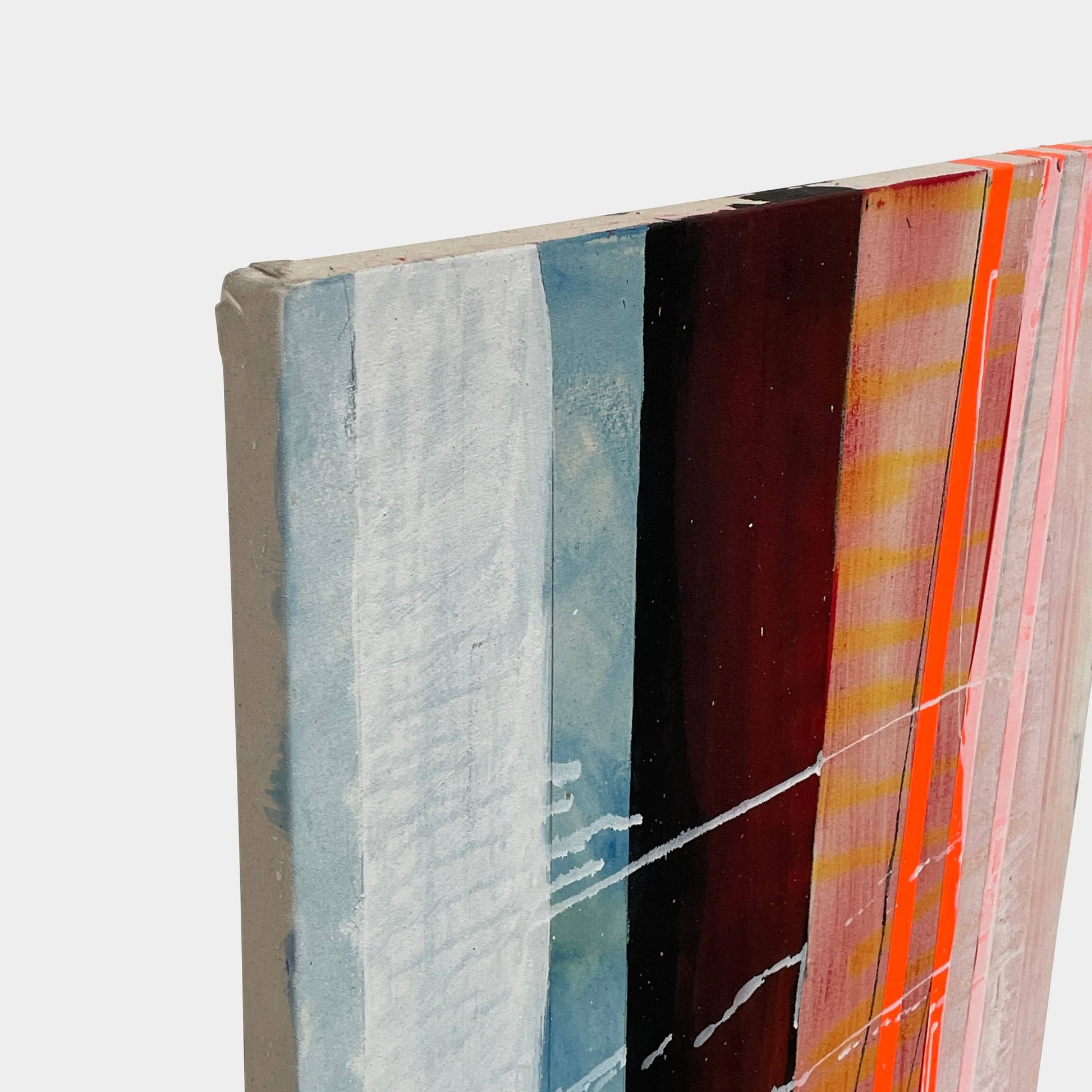 Allison Caesar's 'Untitled #50' features an abstract painting of vertical stripes in blue, black, red, pink, and white. Textured brushstrokes evoke an industrial landscape feel with depth and complexity against a neutral backdrop.