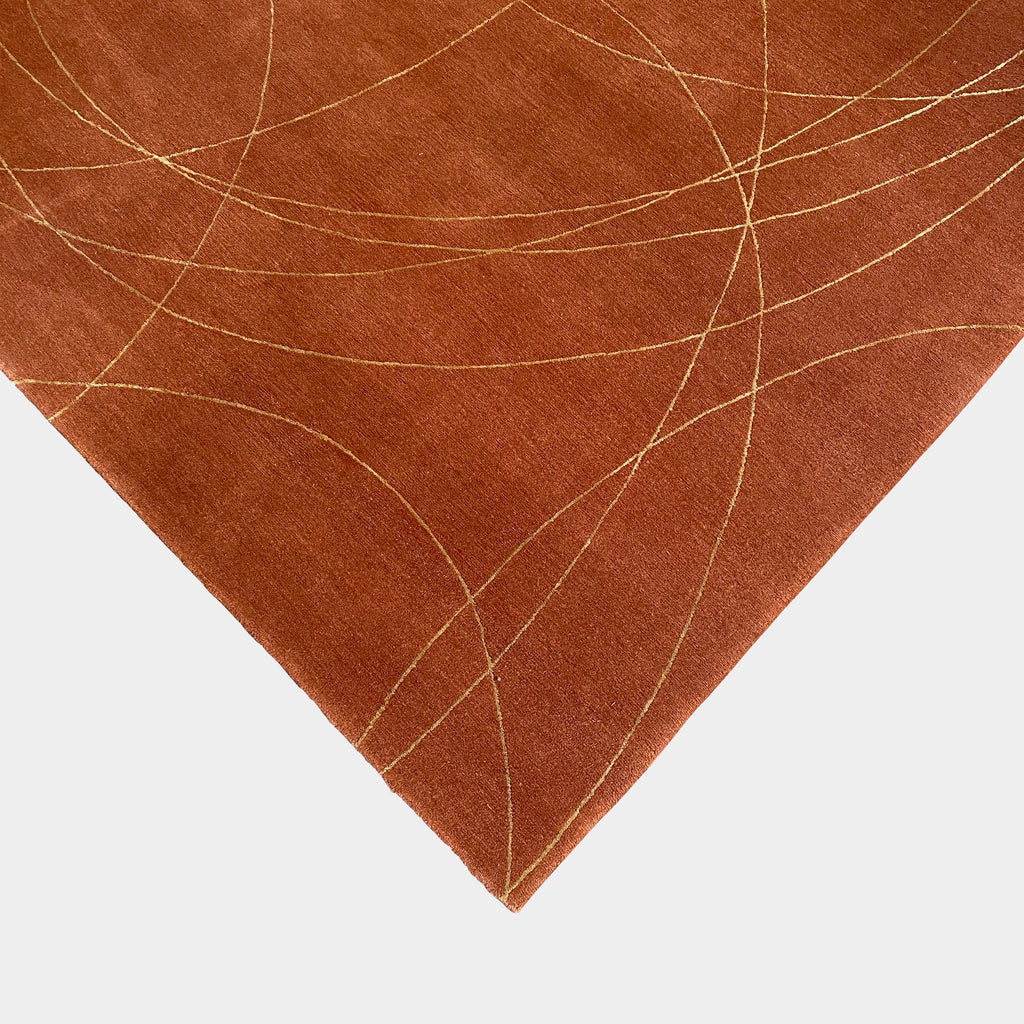 A Coil 9'X12' Wool Rug with gold lines on it, made of wool field and gold silk, by Delinear.