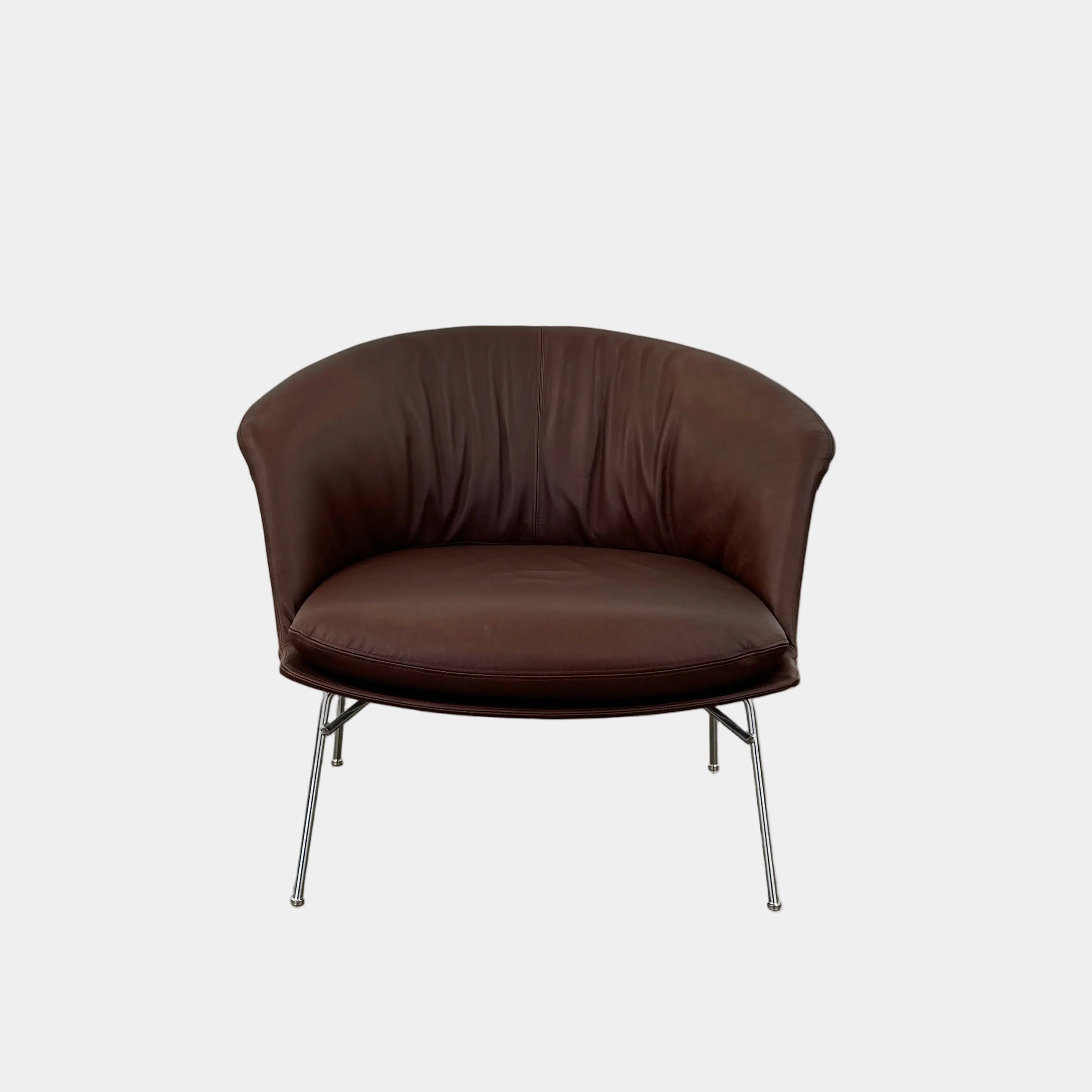 The Driade Moon Lounge Chair by Driade features a modern brown leather design, curved backrest, and slim metal legs, shown against a plain white background.