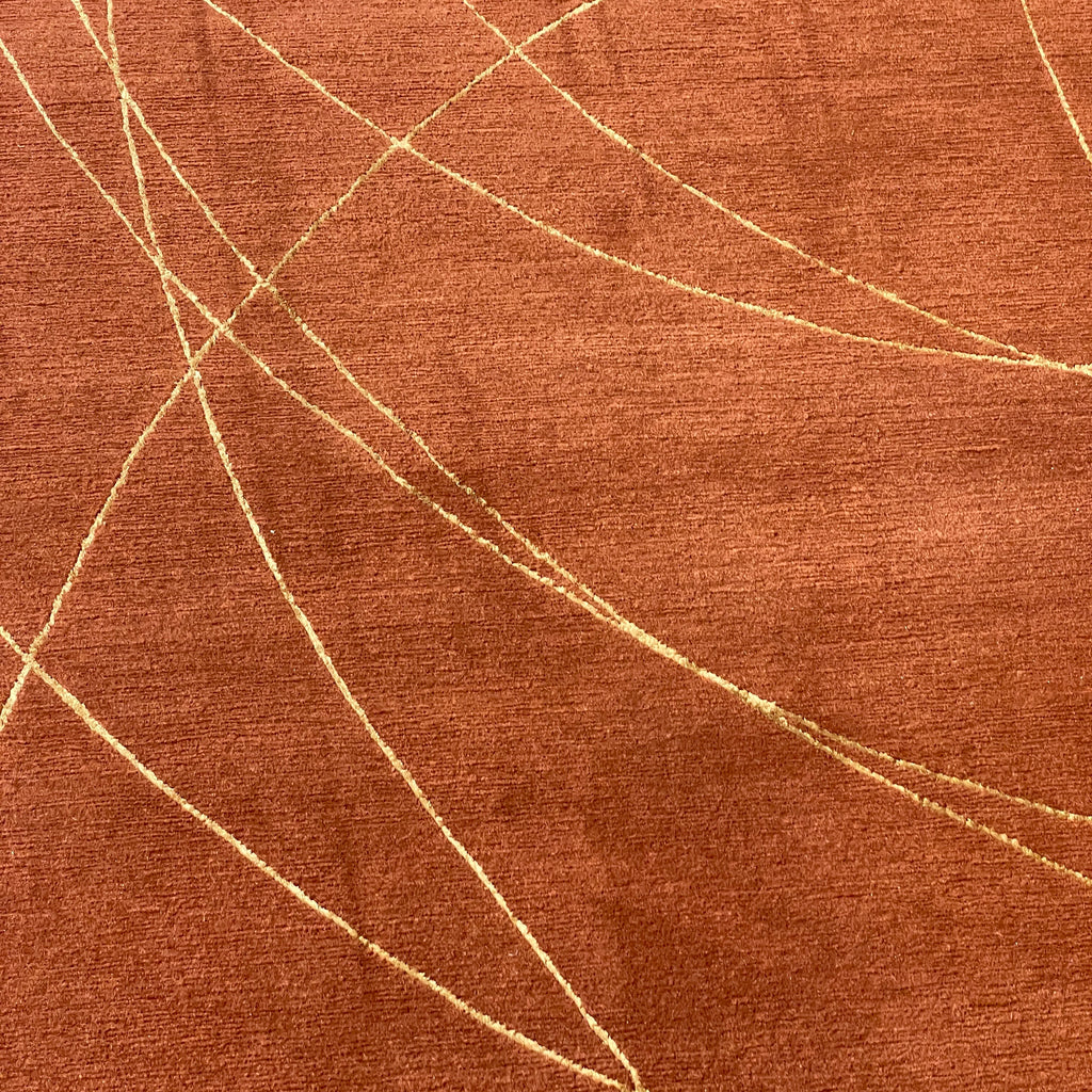 A Delinear Coil 9'X12' Wool Rug (ON HOLD) with gold lines on it.