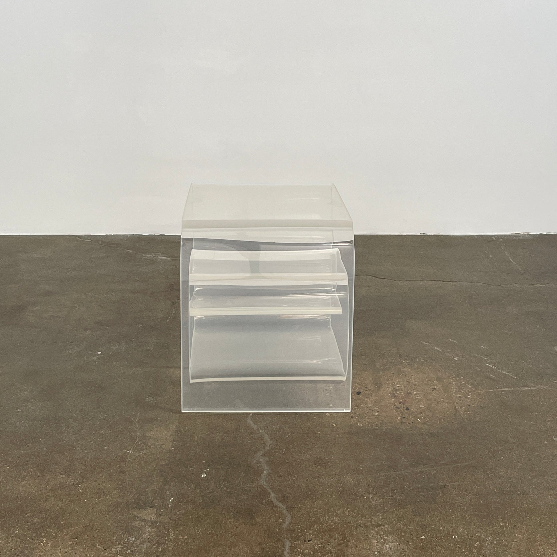 The Vintage Modern Lucite Scroll Accent Table features a clear, sculptural design—an iconic 1960s/70s piece that brings retro charm and modern style to any space.