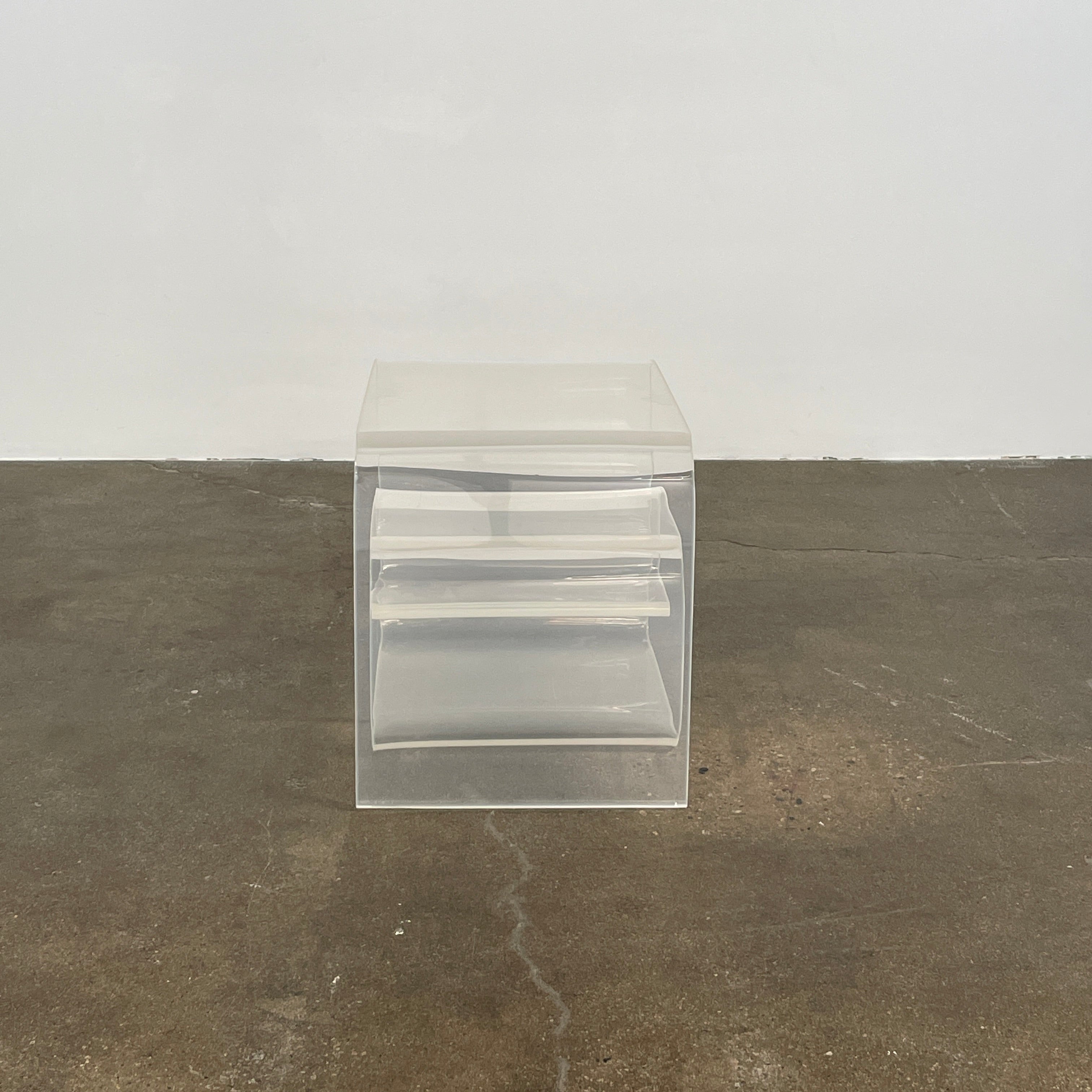 The Vintage Modern Lucite Scroll Accent Table features a clear, sculptural design—an iconic 1960s/70s piece that brings retro charm and modern style to any space.