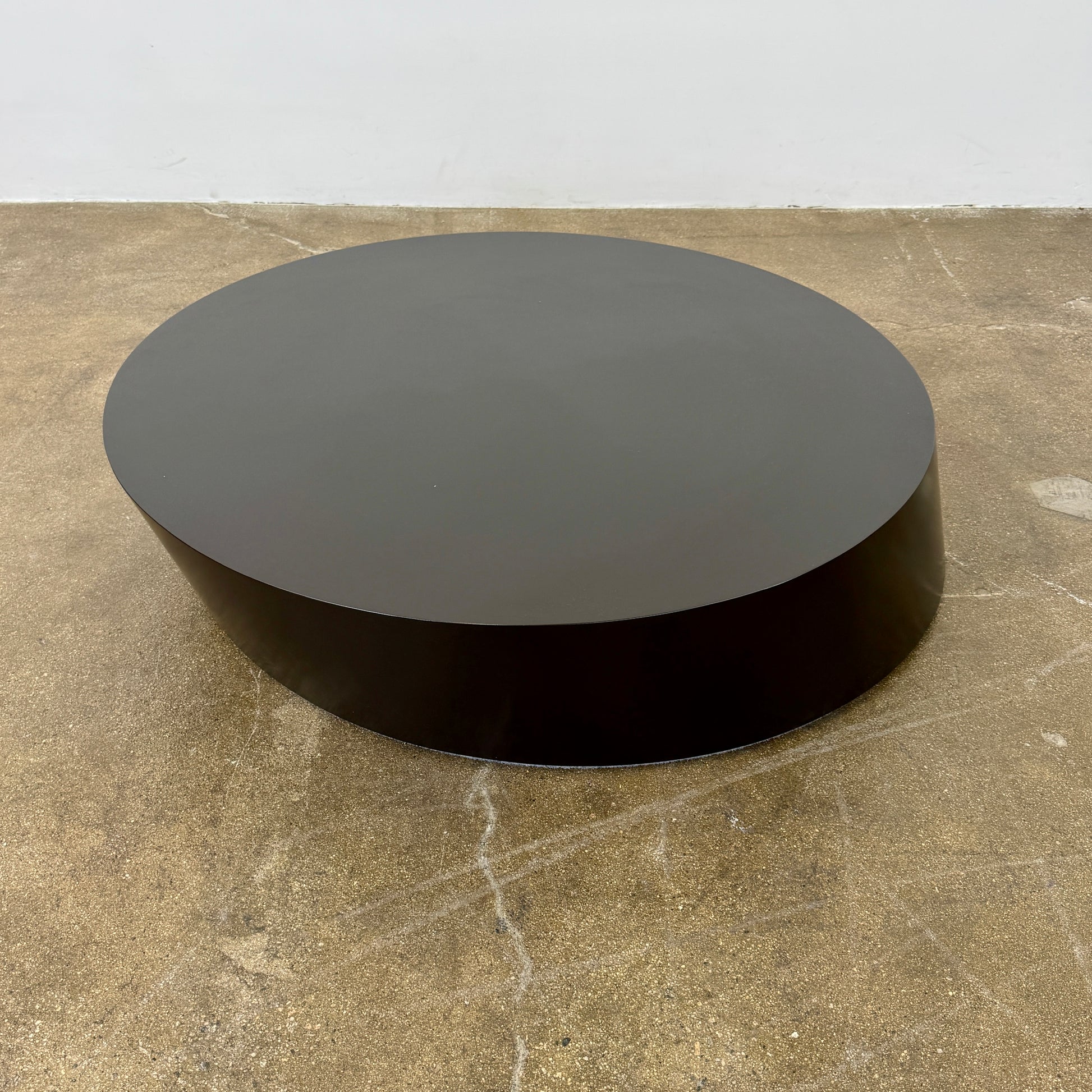 The La Cividina Scancaro Coffee Table 8836 by La Cividina features authentic craftsmanship with a modern oval design and a flat gray top, elegantly displayed against a plain white background.