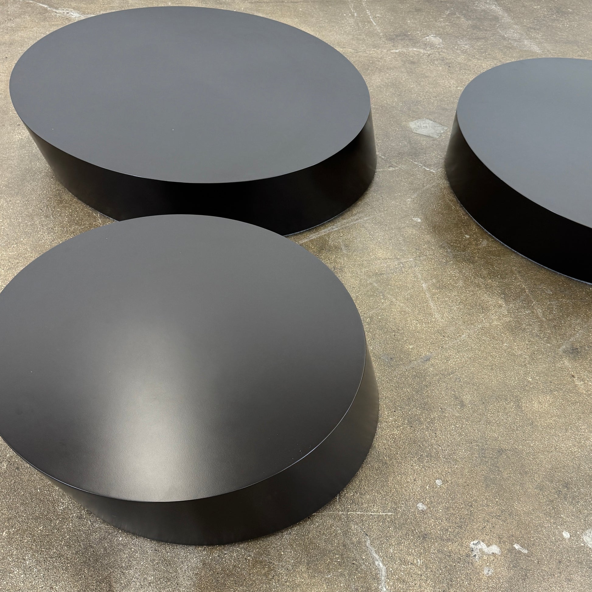 The La Cividina Scancaro Coffee Table 8836 by La Cividina features authentic craftsmanship with a modern oval design and a flat gray top, elegantly displayed against a plain white background.