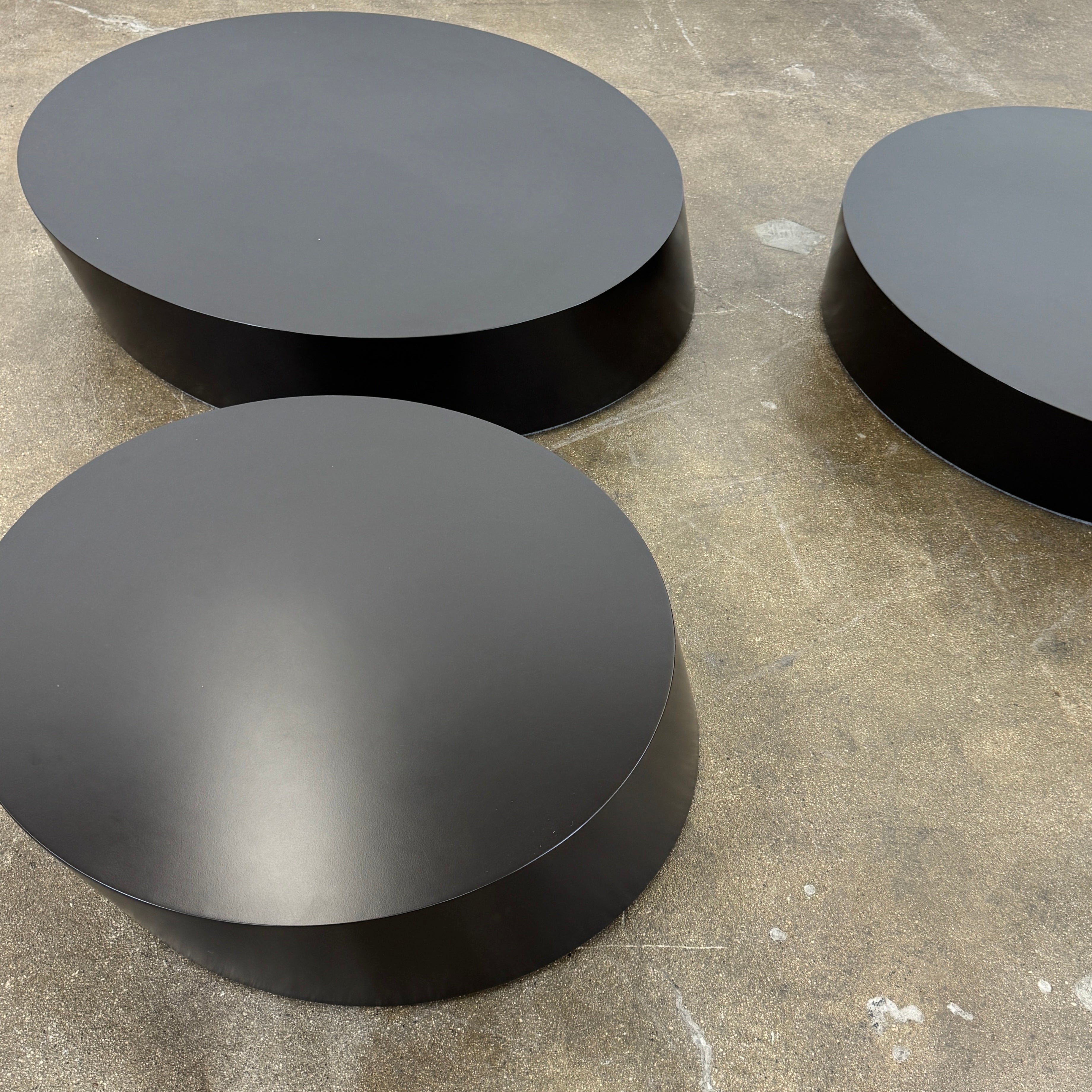 The La Cividina Scancaro Coffee Table 8836 by La Cividina features authentic craftsmanship with a modern oval design and a flat gray top, elegantly displayed against a plain white background.