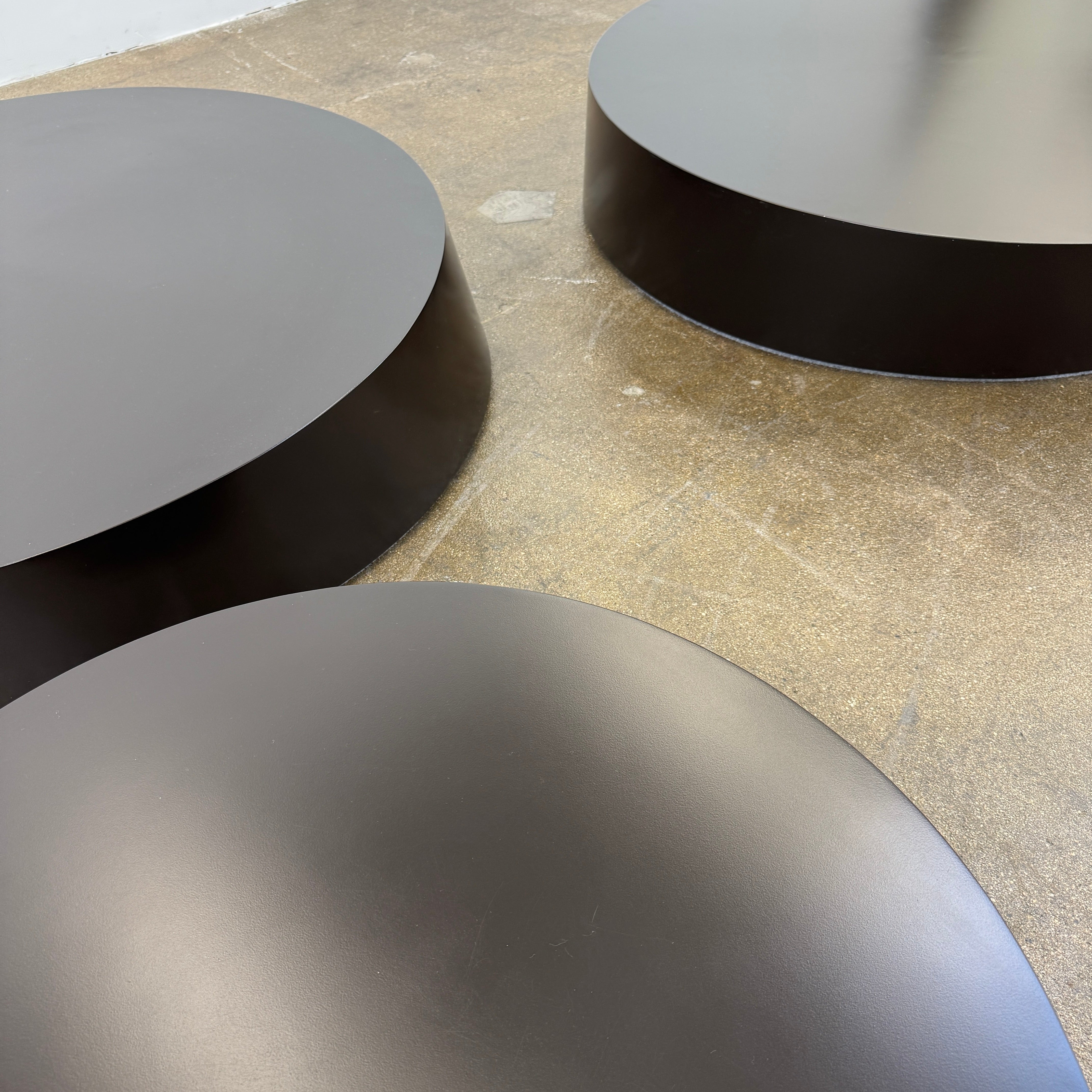 The La Cividina Scancaro Coffee Table 8836 by La Cividina features authentic craftsmanship with a modern oval design and a flat gray top, elegantly displayed against a plain white background.