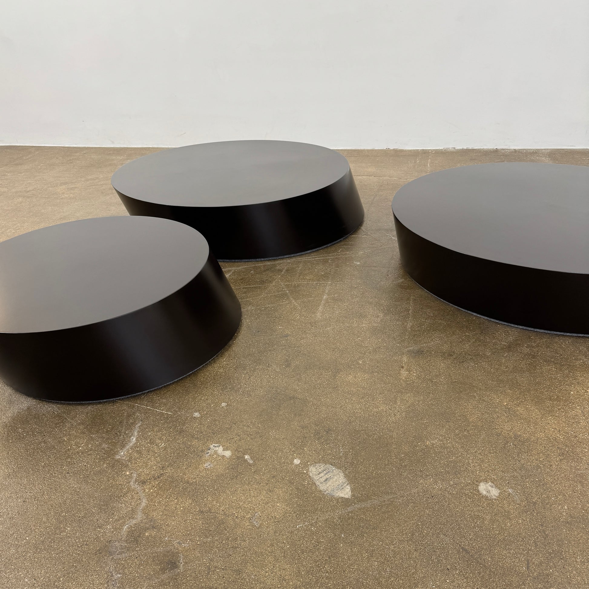 The La Cividina Scancaro Coffee Table 8836 by La Cividina features authentic craftsmanship with a modern oval design and a flat gray top, elegantly displayed against a plain white background.