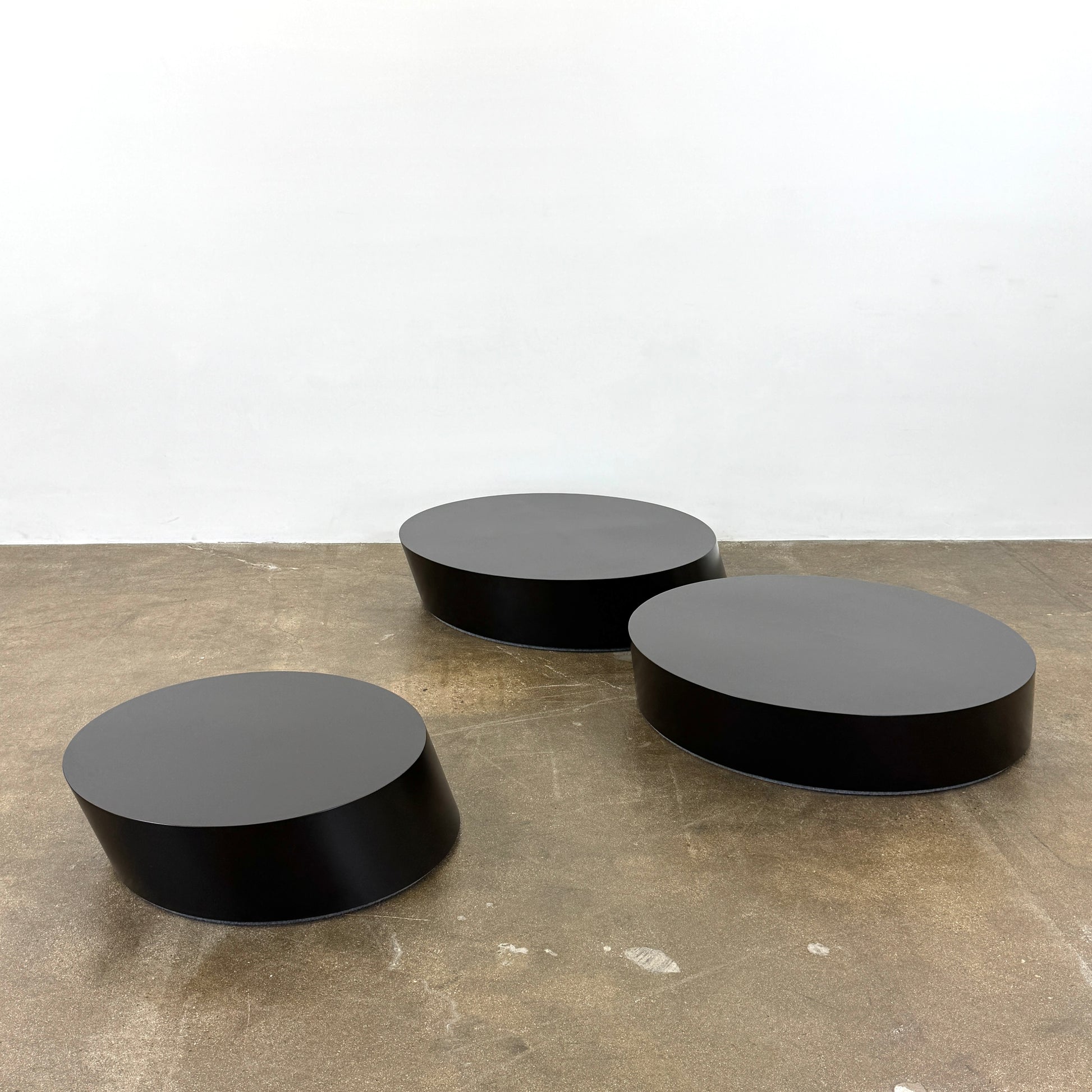 The La Cividina Scancaro Coffee Table 8836 by La Cividina features authentic craftsmanship with a modern oval design and a flat gray top, elegantly displayed against a plain white background.