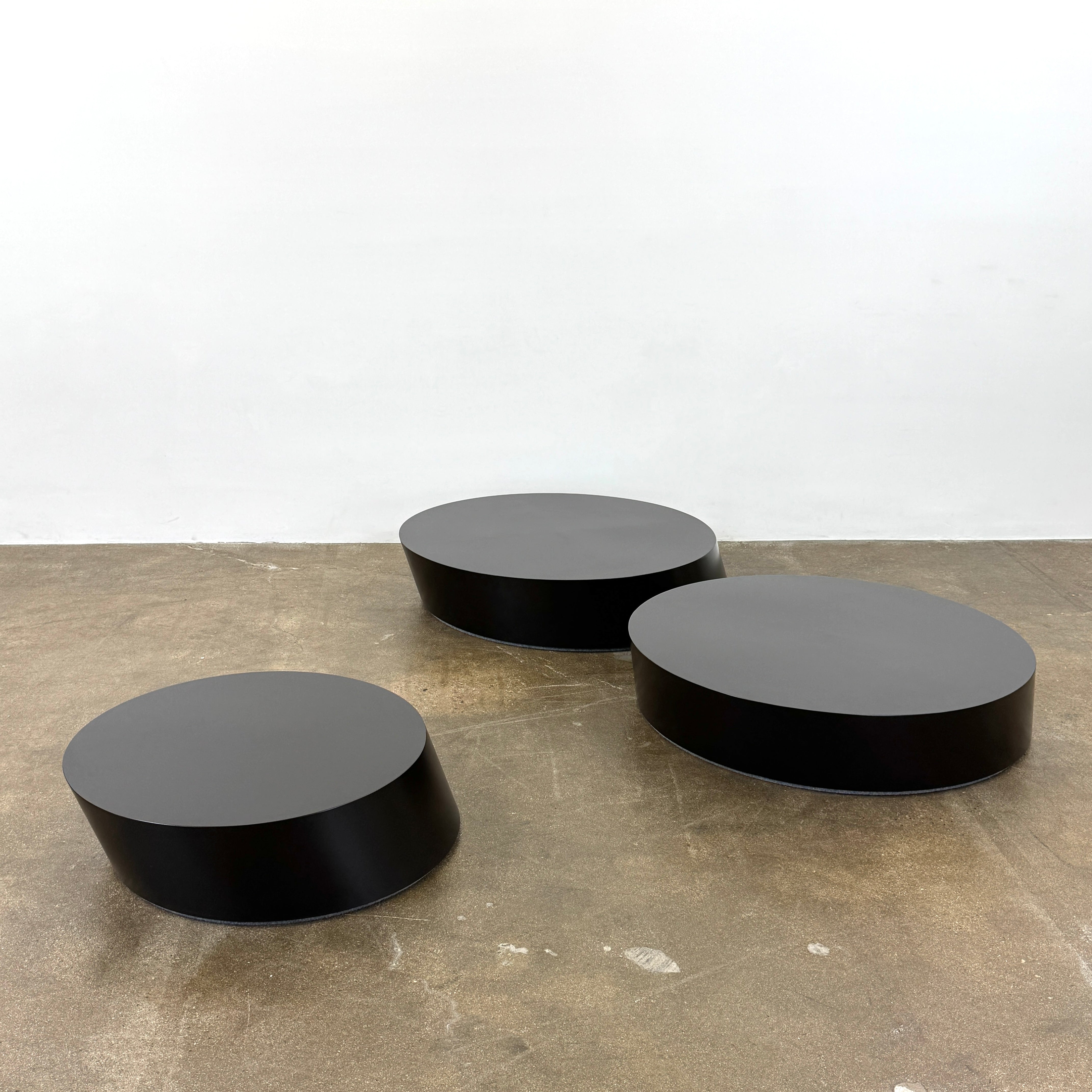 The La Cividina Scancaro Coffee Table 8836 by La Cividina features authentic craftsmanship with a modern oval design and a flat gray top, elegantly displayed against a plain white background.