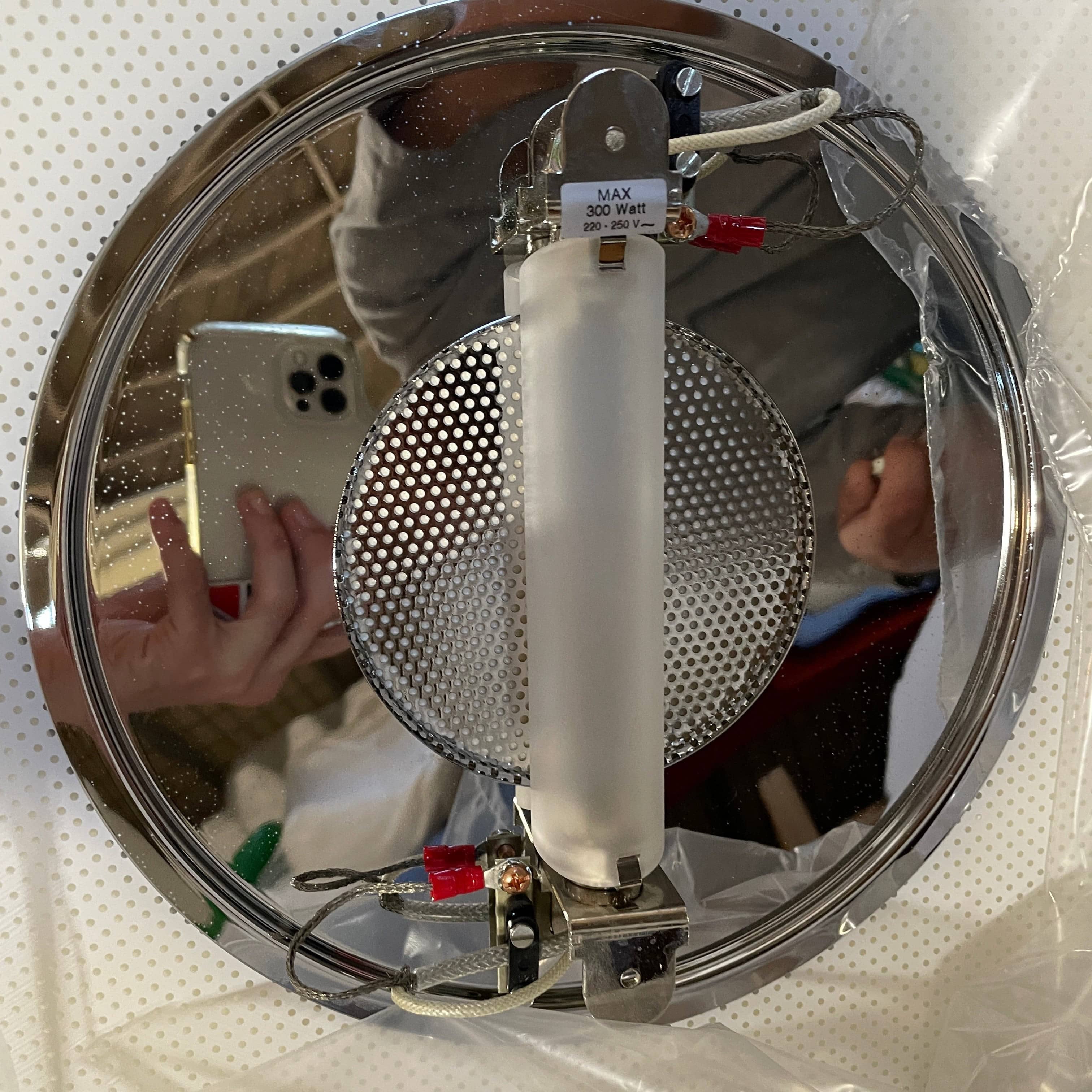 Modern pendant light with a minimalist design, suspended from a metallic base by two cables, the Studio Design Italia Rondo SO Ceiling Light.