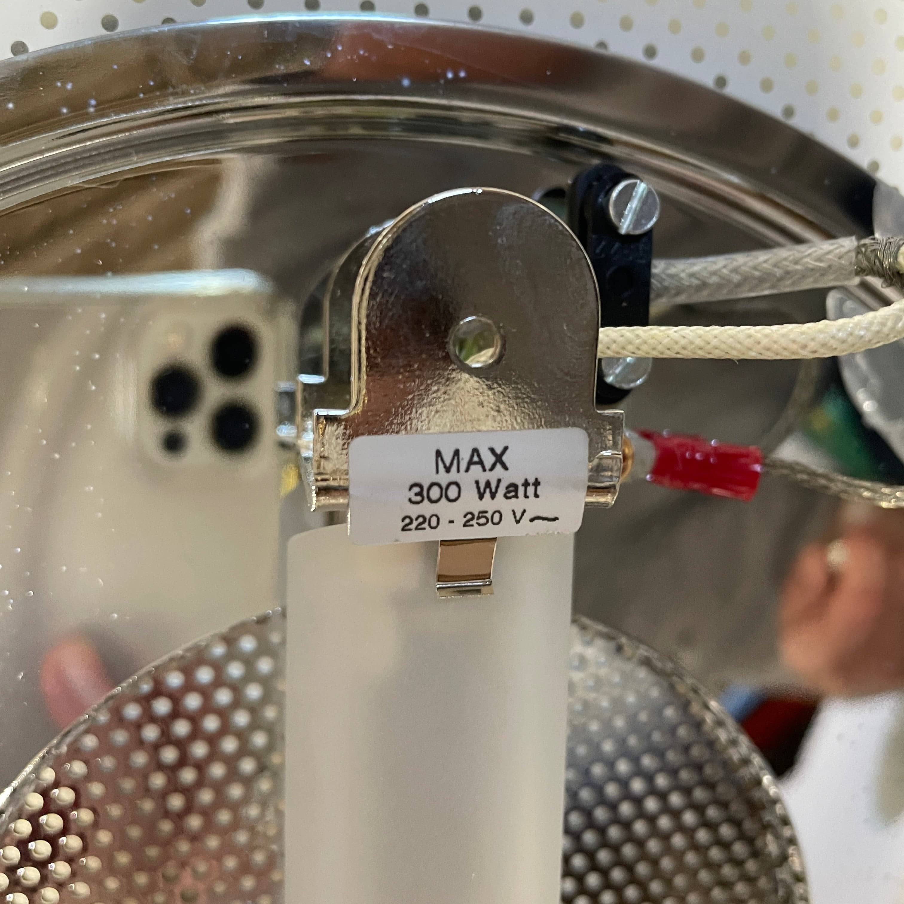 Modern pendant light with a minimalist design, suspended from a metallic base by two cables, the Studio Design Italia Rondo SO Ceiling Light.