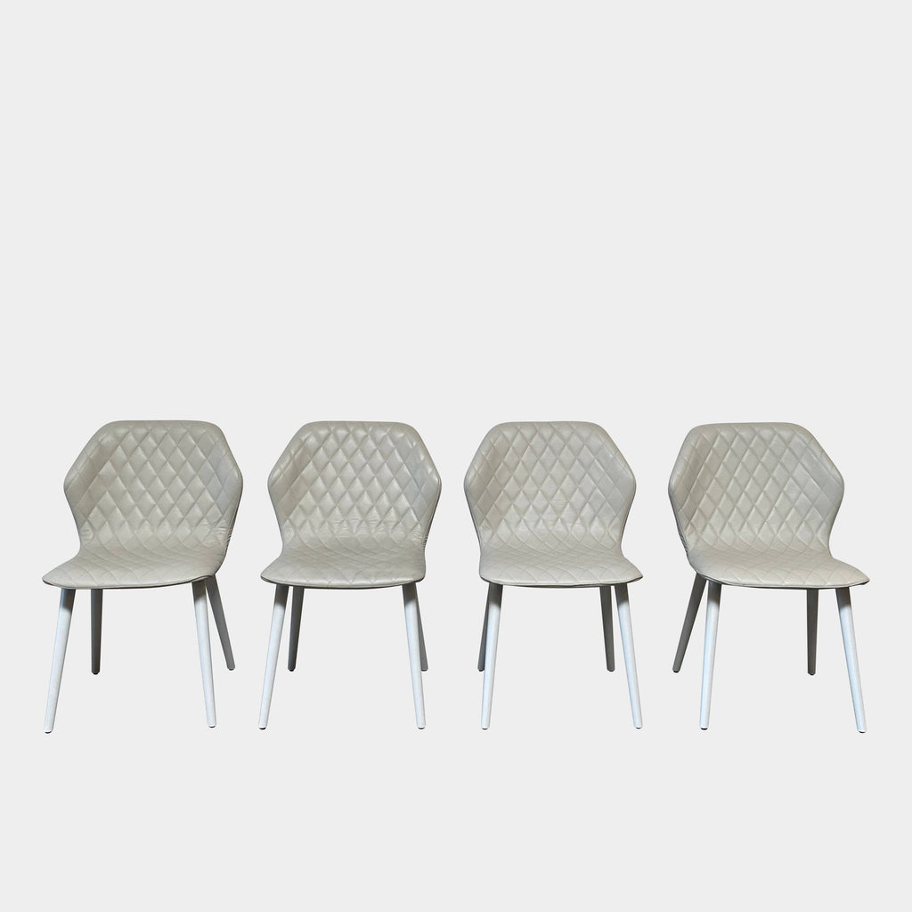 Four Bross Ava Dining Chairs with white legs on a white background.