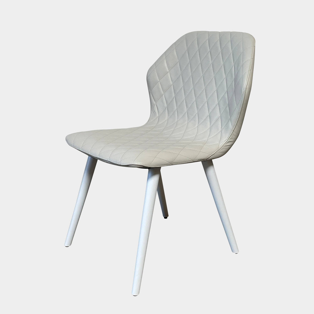 Four Bross Ava Dining Chairs with white legs on a white background.
