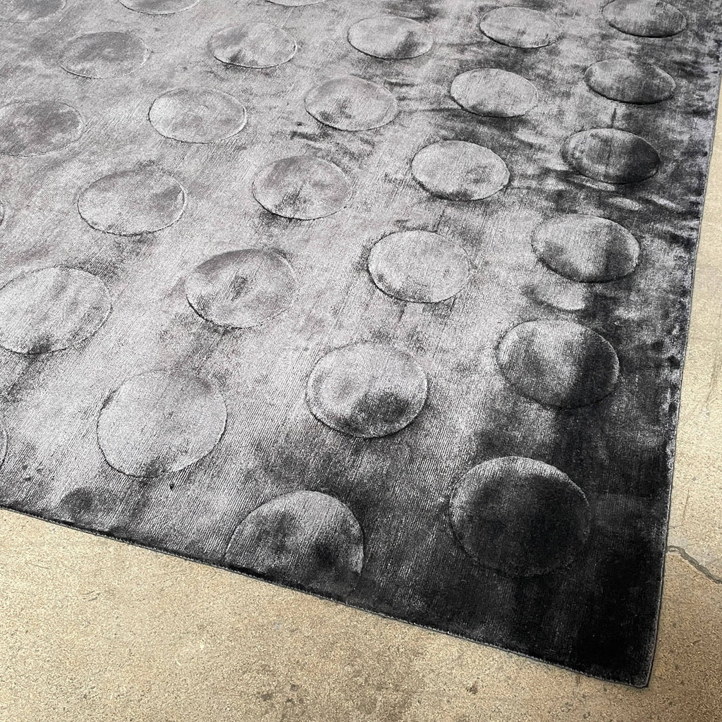 A black and white image of a Delinear High-Tech 9'x12' Rug on a flat surface covered with a pattern that appears to be embossed or raised, displayed against a white background.