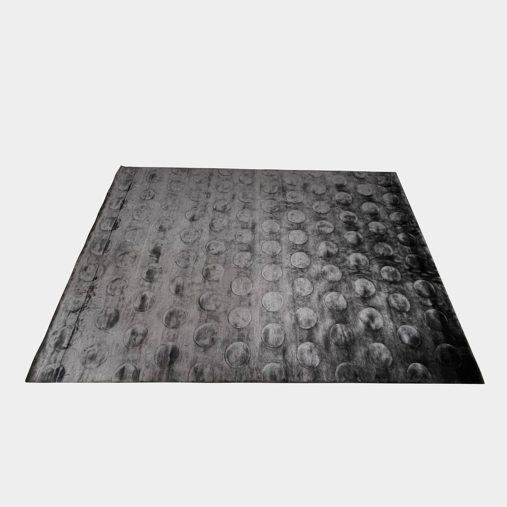 A black and white image of a Delinear High-Tech 9'x12' Rug on a flat surface covered with a pattern that appears to be embossed or raised, displayed against a white background.