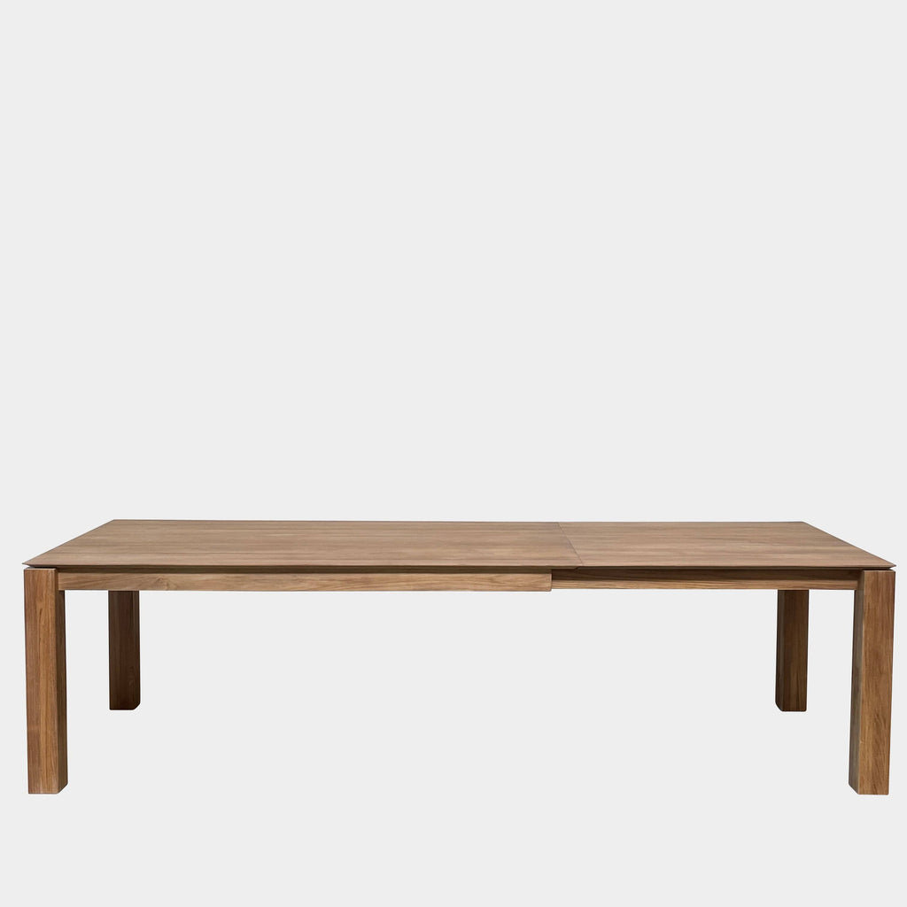 An Ethnicraft Slice Extendable Dining Table on a white background.