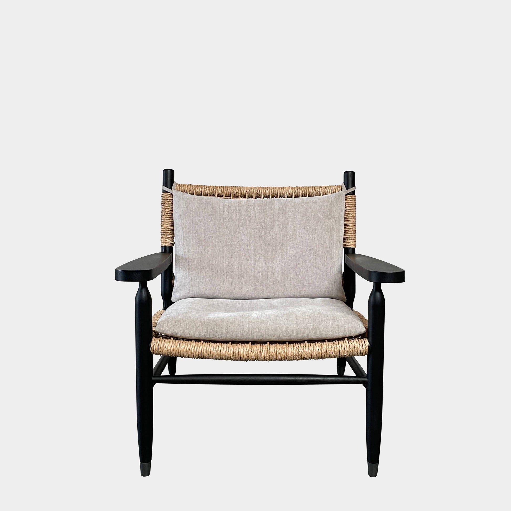 Two hand-crafted Flexform Tessa Lounge Chairs with black frames and neutral-tone cushions on a white background.