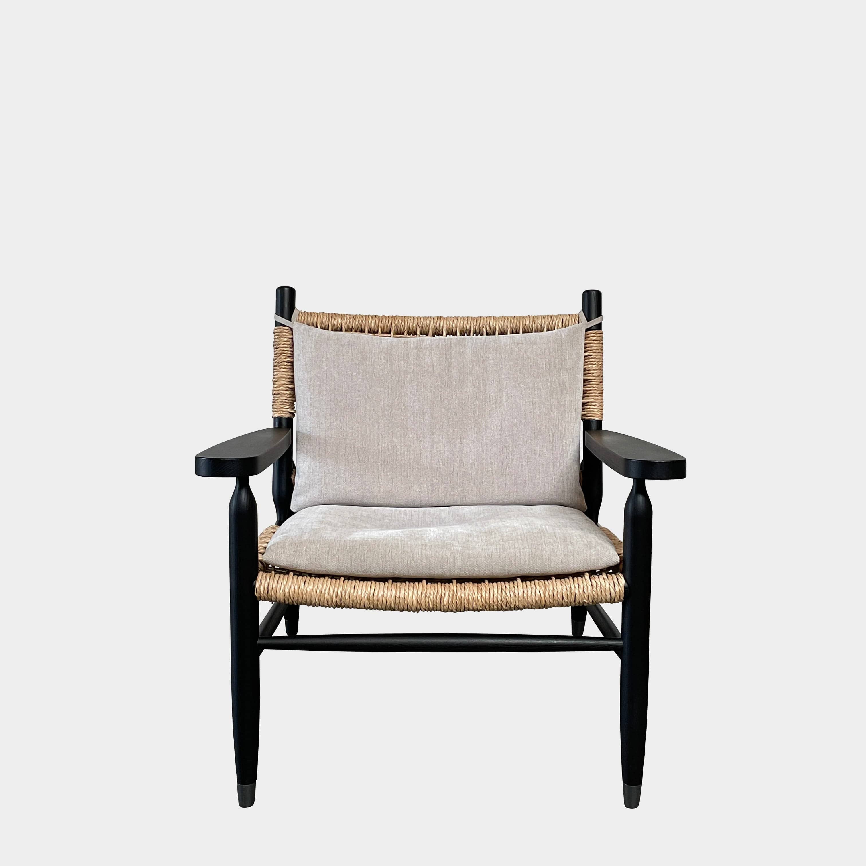 Two hand-crafted Flexform Tessa Lounge Chairs with black frames and neutral-tone cushions on a white background.